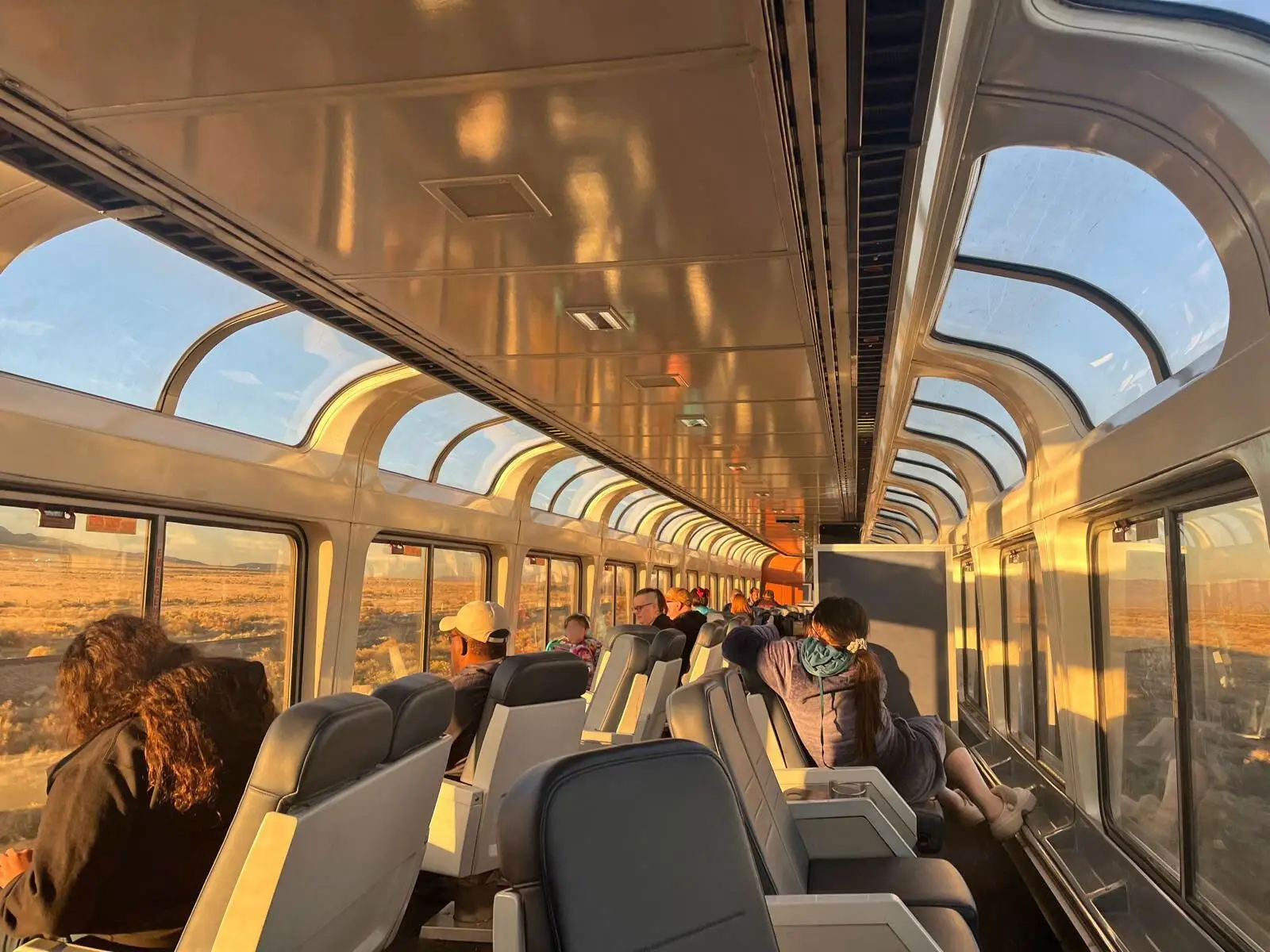 The sightseer car on an Amtrak train at sunset.