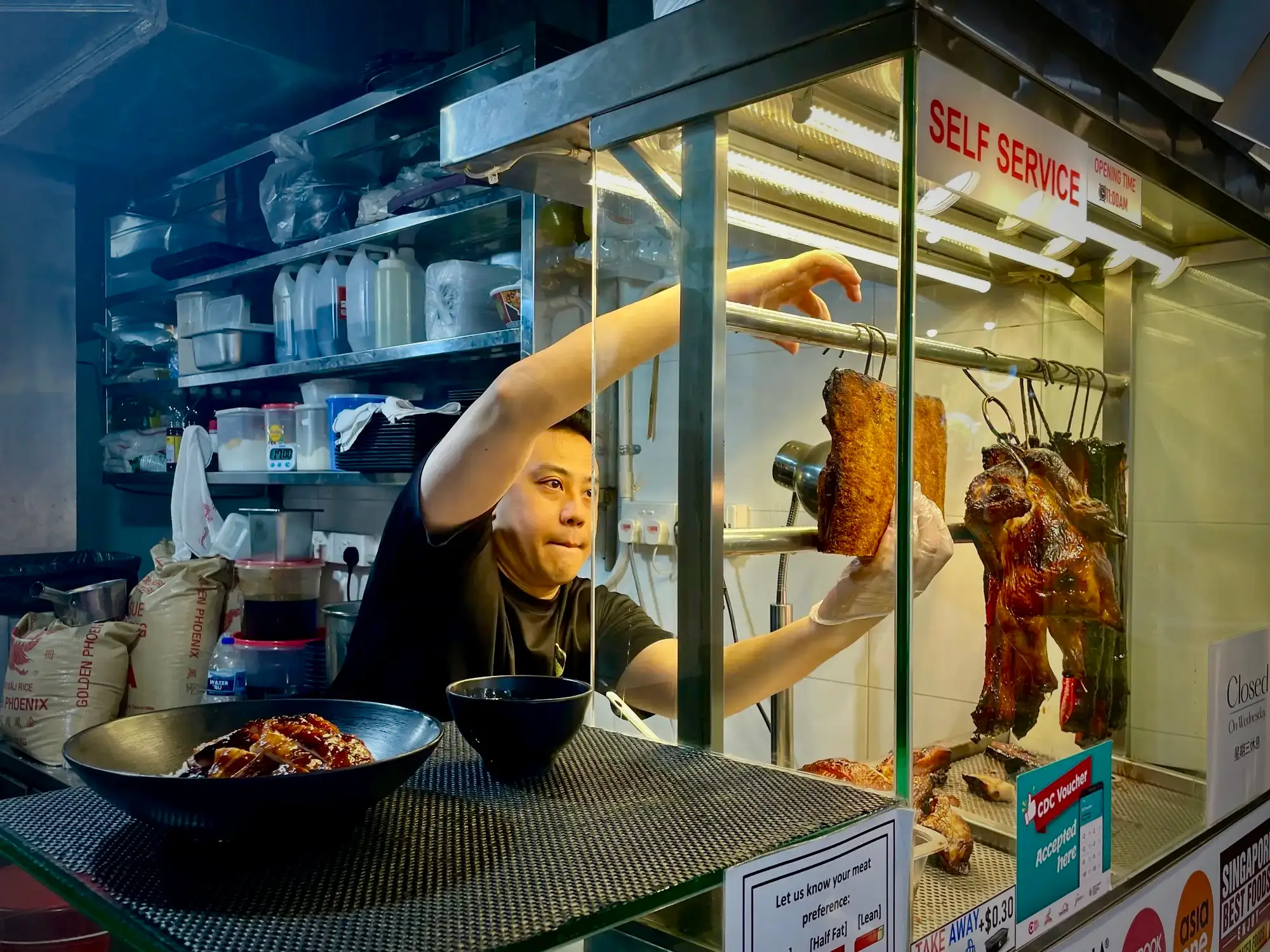 Ivan Leong, the owner of the Cantonese roast pork stall Char Siu Lang, runs two outlets in Singapore.