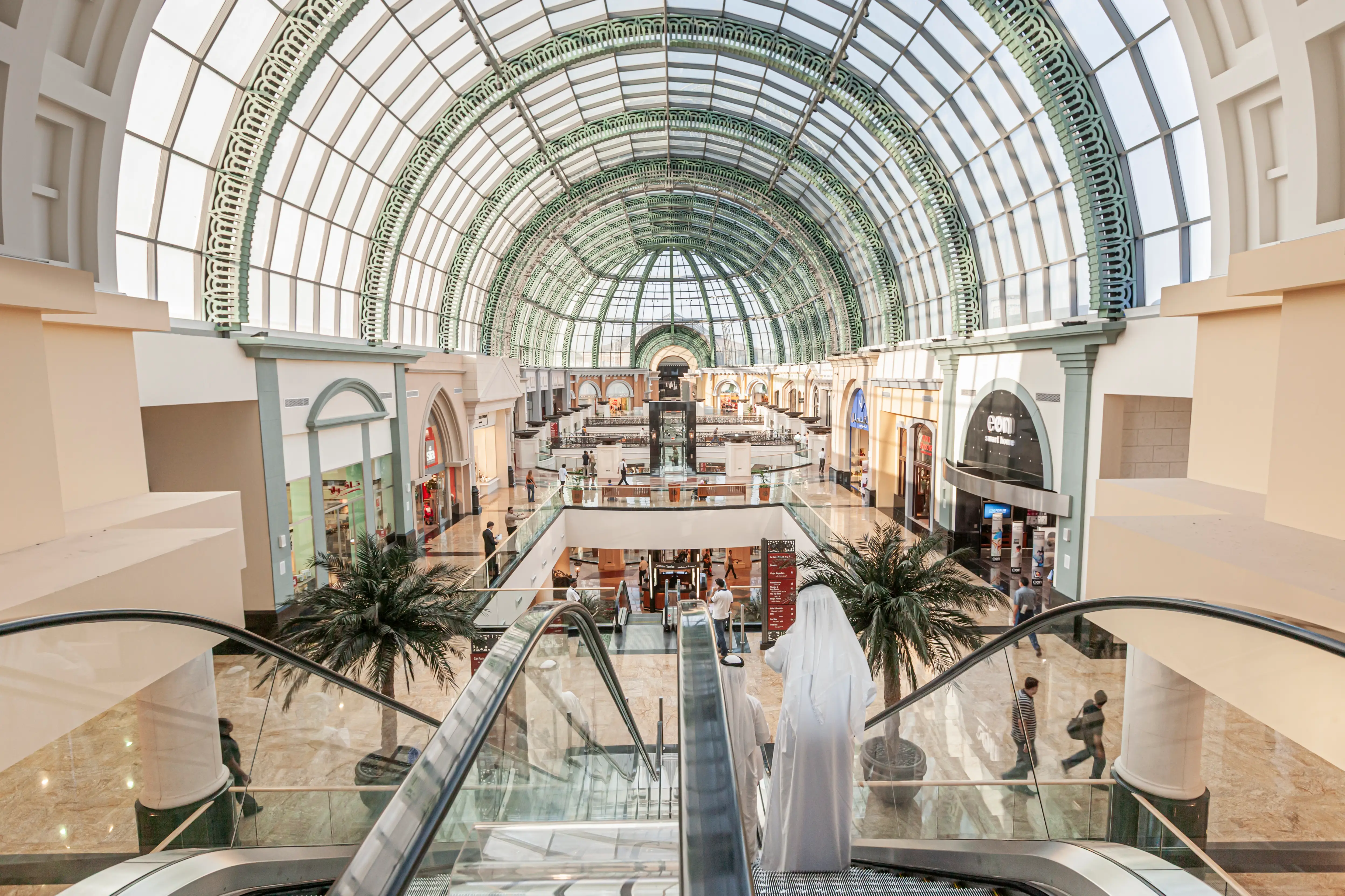 The view from the top of an escalator in an atrium in the Mall of the Emirates shopping center in Dubai,