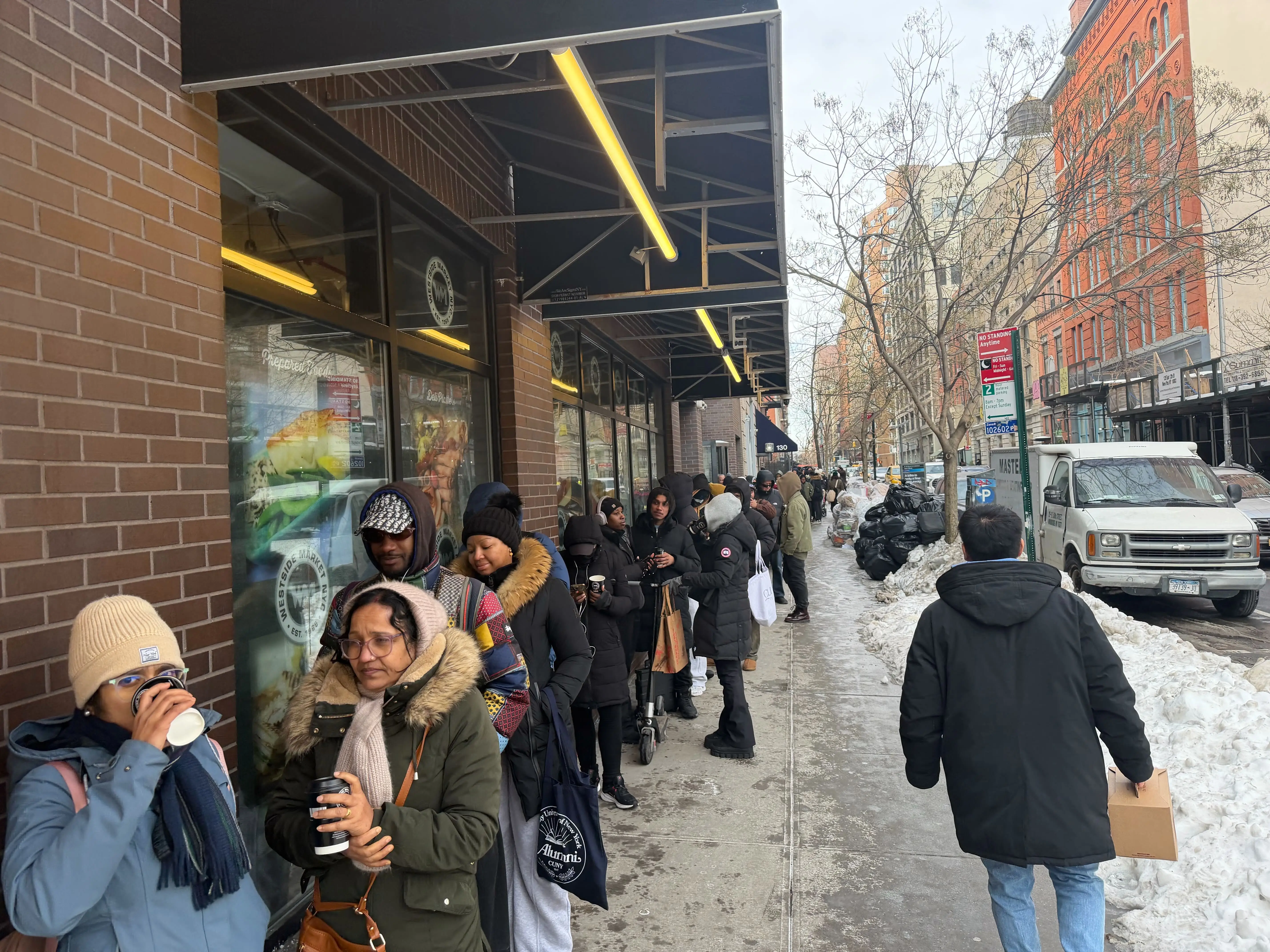 A photo of the long line for Kalshi's $50 grocery giveaway in NYC on February 3, 2026.