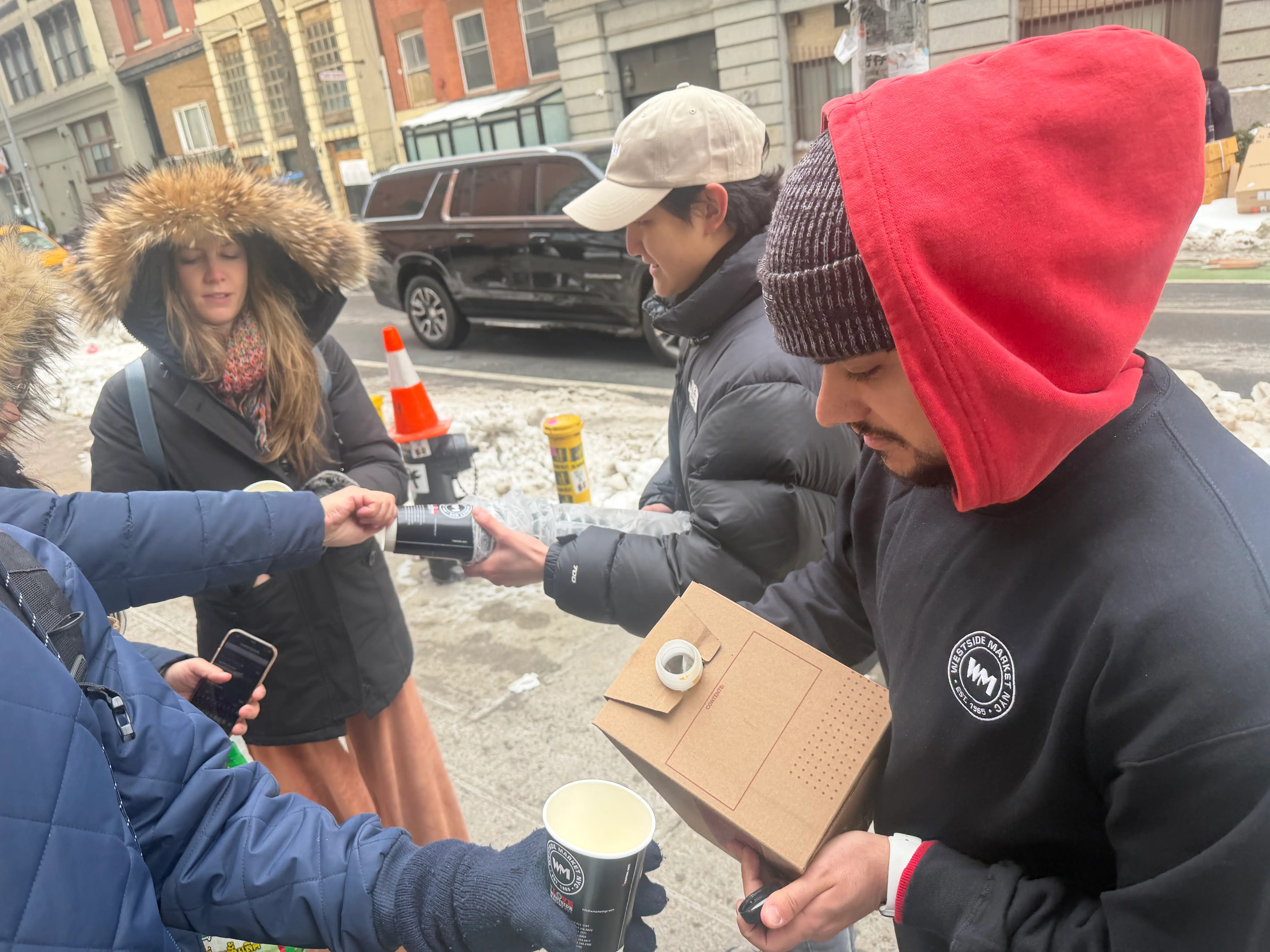 A man pouring out hot coffee is pictured at Kalshi's grocery store.