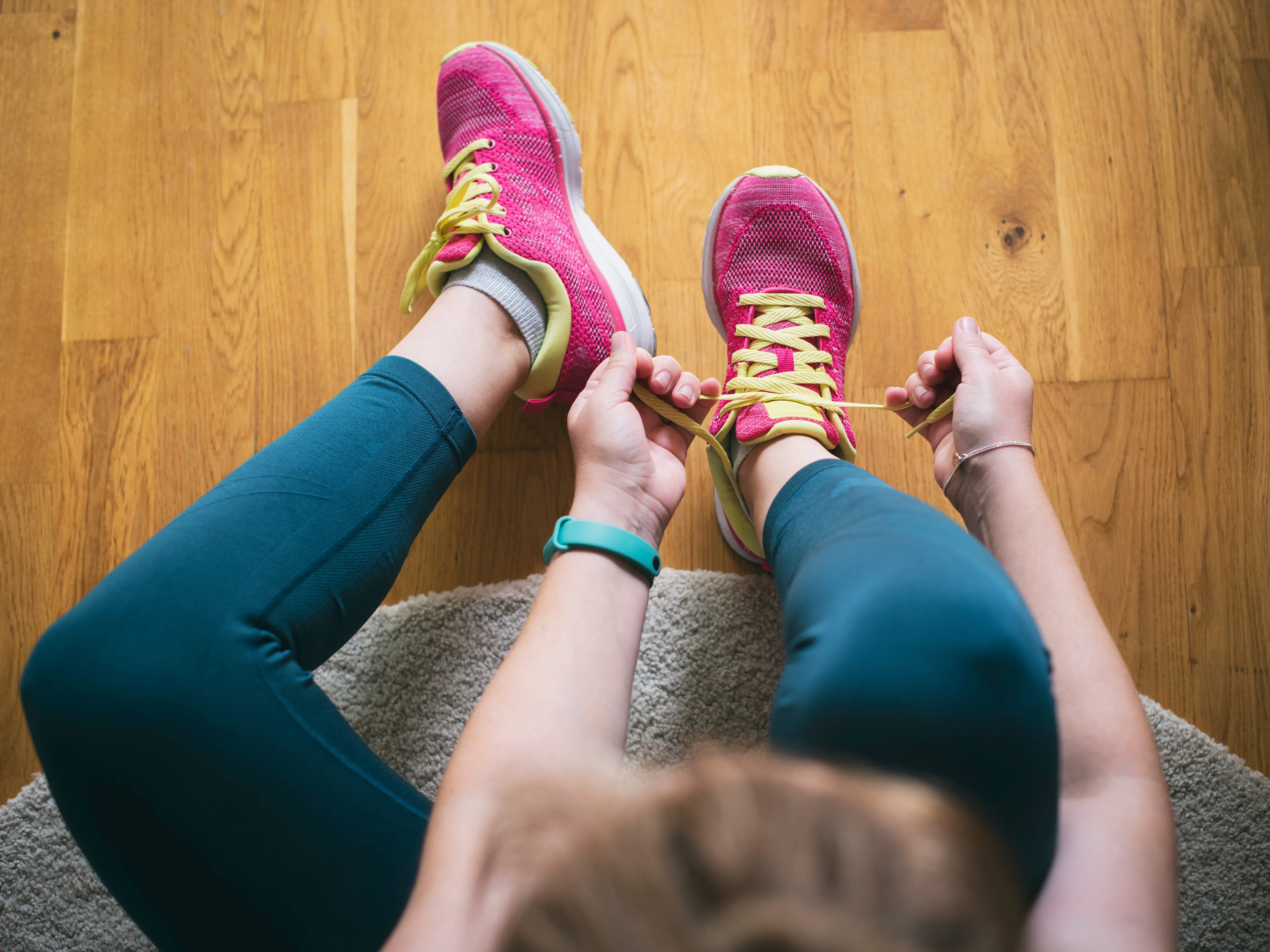 Woman lacing sneakers