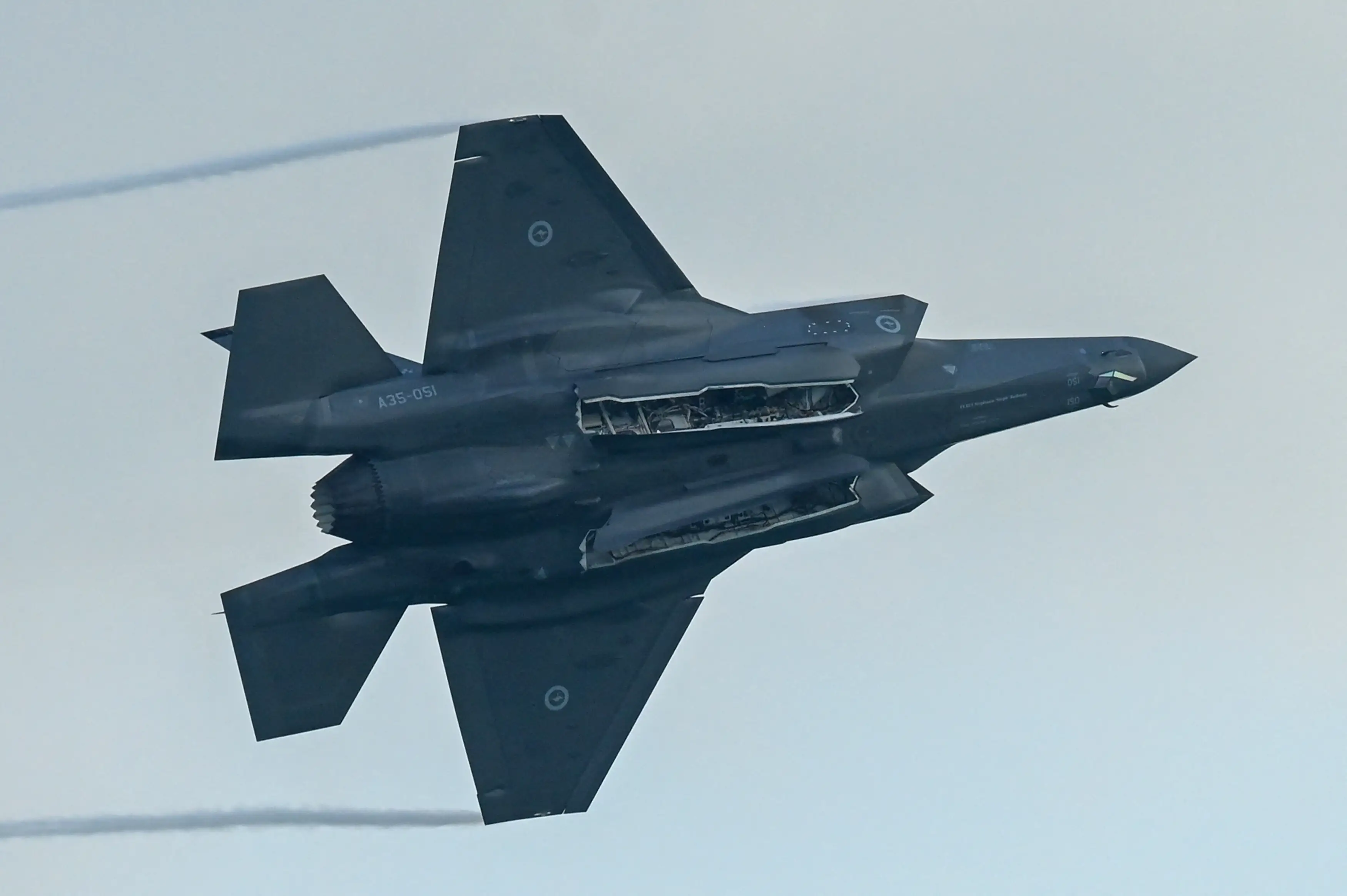 An F-35 opens its weapons bay.