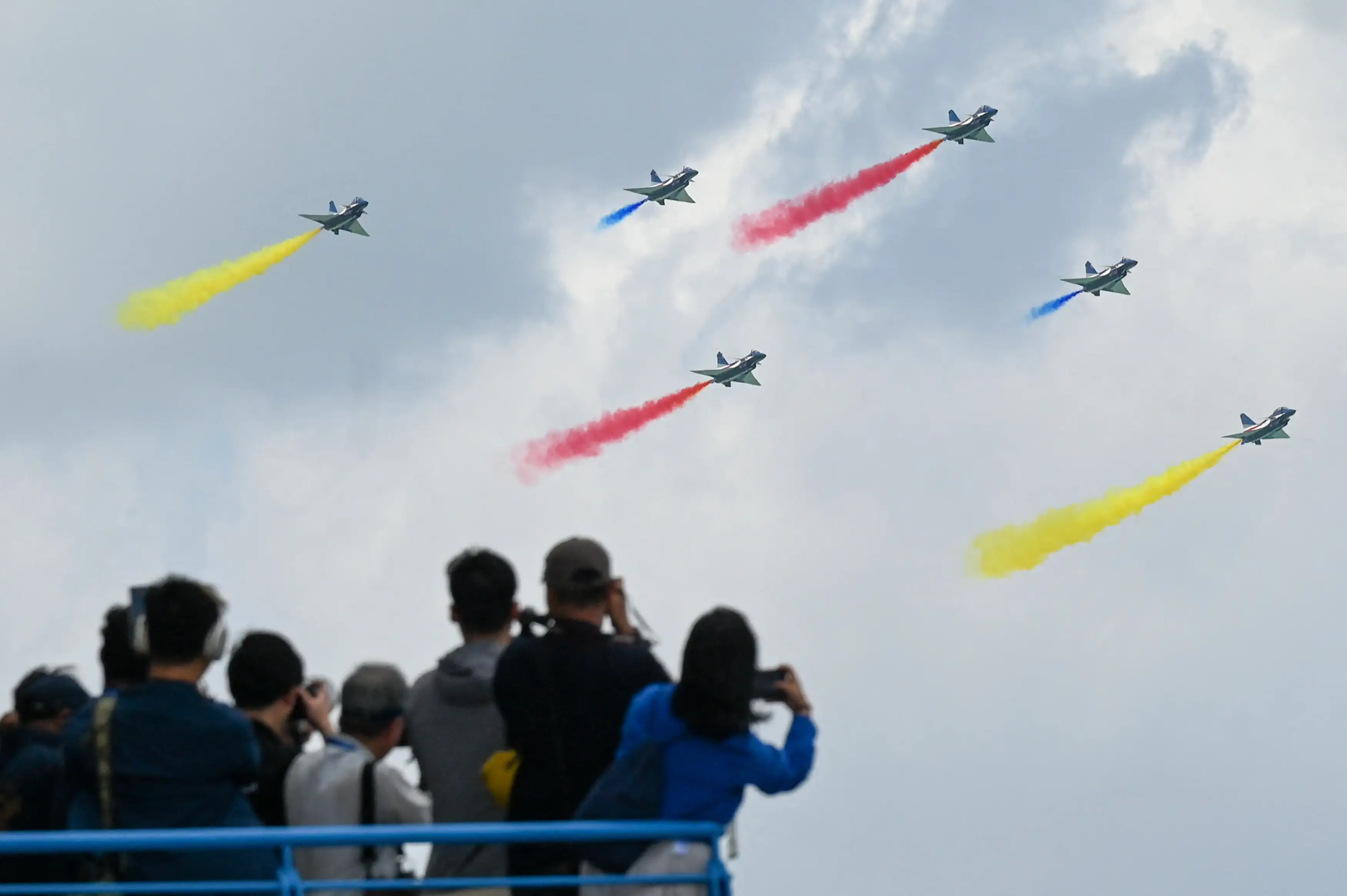 Six J-10C aircraft of China's Ba Yi aerobatics team perform a formation maneuver.