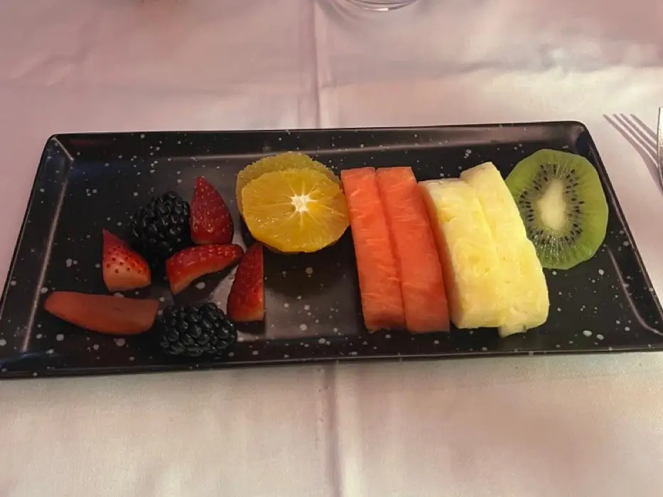 Tray of fruit on white tablecloth