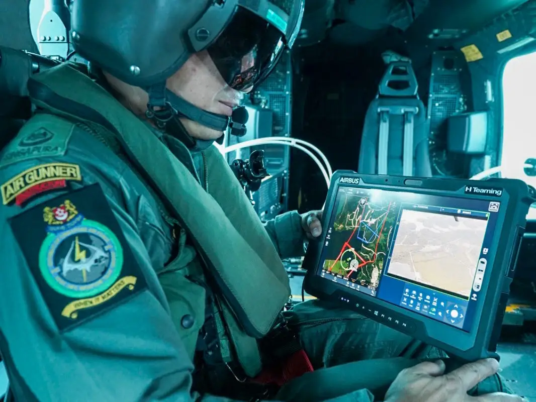 A Singaporean helicopter crew operator uses an HTeaming tablet.