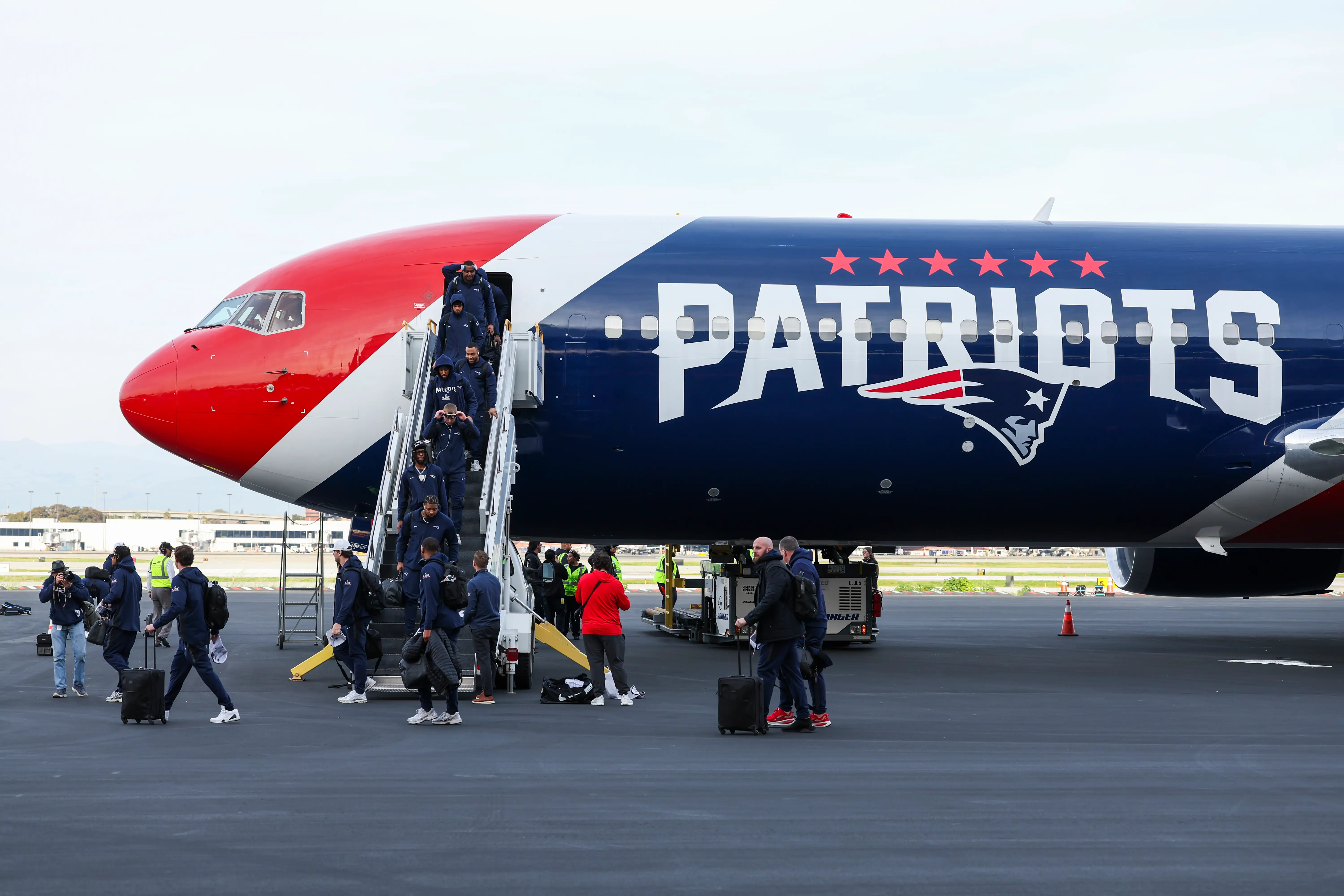 New England Patriots players arrive at San Jose Mineta International Airport ahead of Super Bowl LX on February 1, 2026 in San Jose, California.
