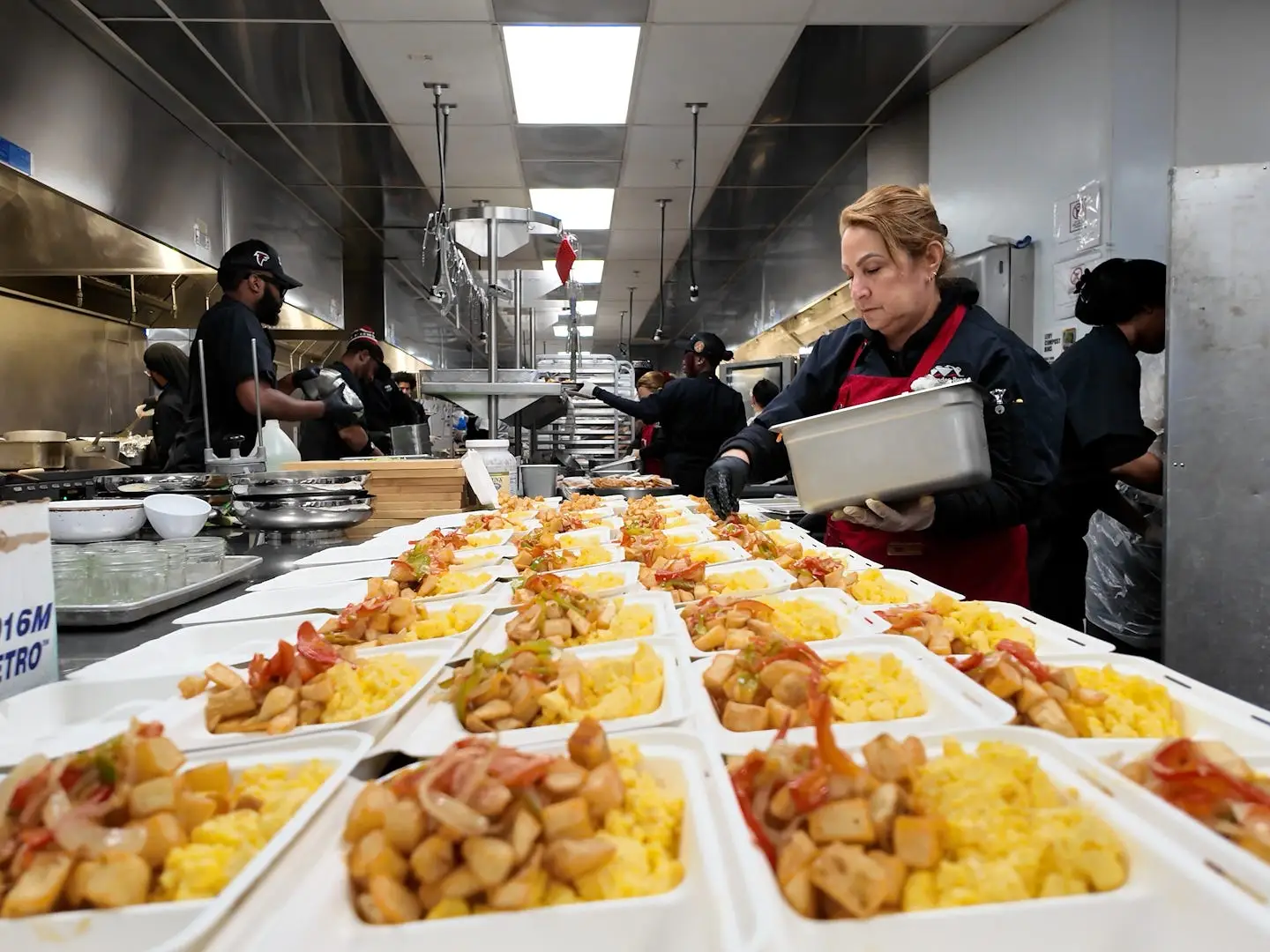 people preparing food at mercedes-benz stadium