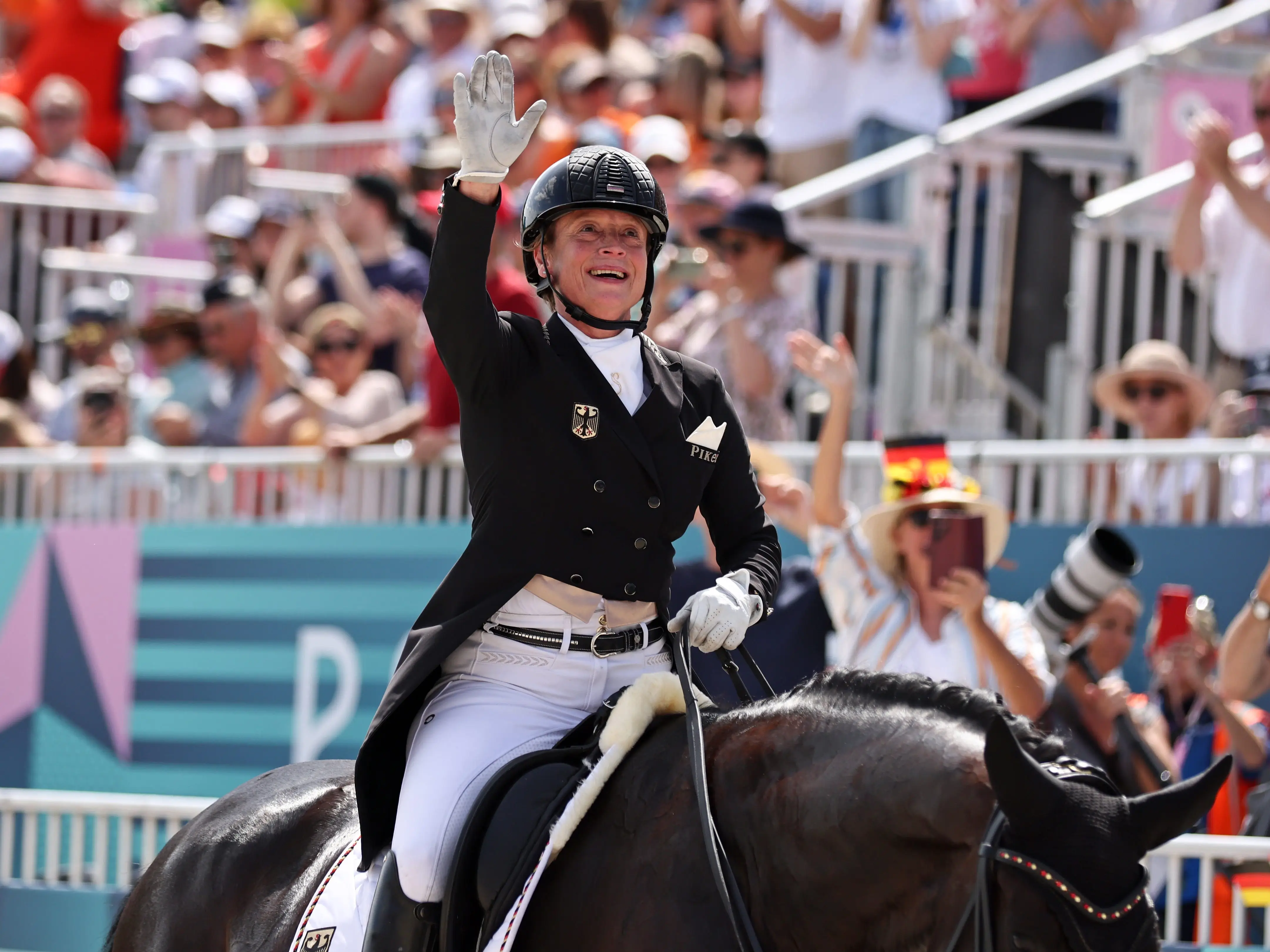 Isabell Werth with Wendy of team Germany reacts after the Dressage Individual Grand Prix Freestyle on day nine of the Olympic Games Paris 2024 at Chateau de Versailles on August 04, 2024 in Versailles, France