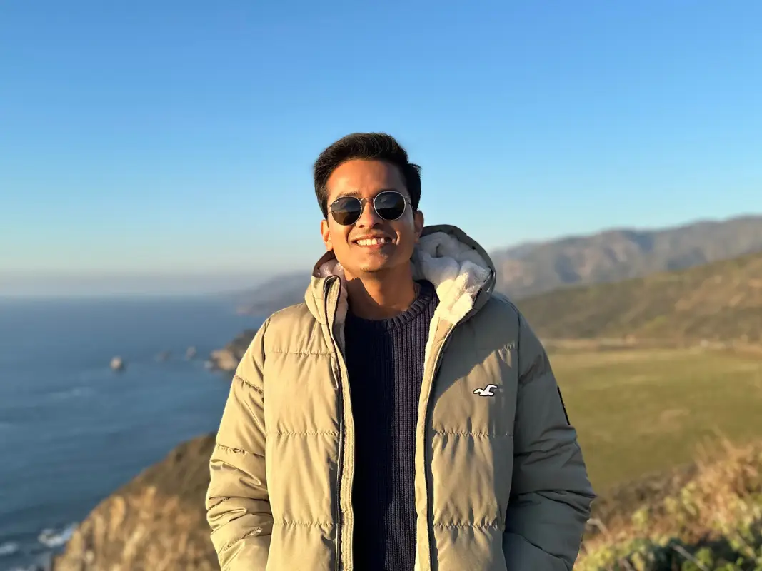 Pronnoy Goswami is standing at an ocean view.