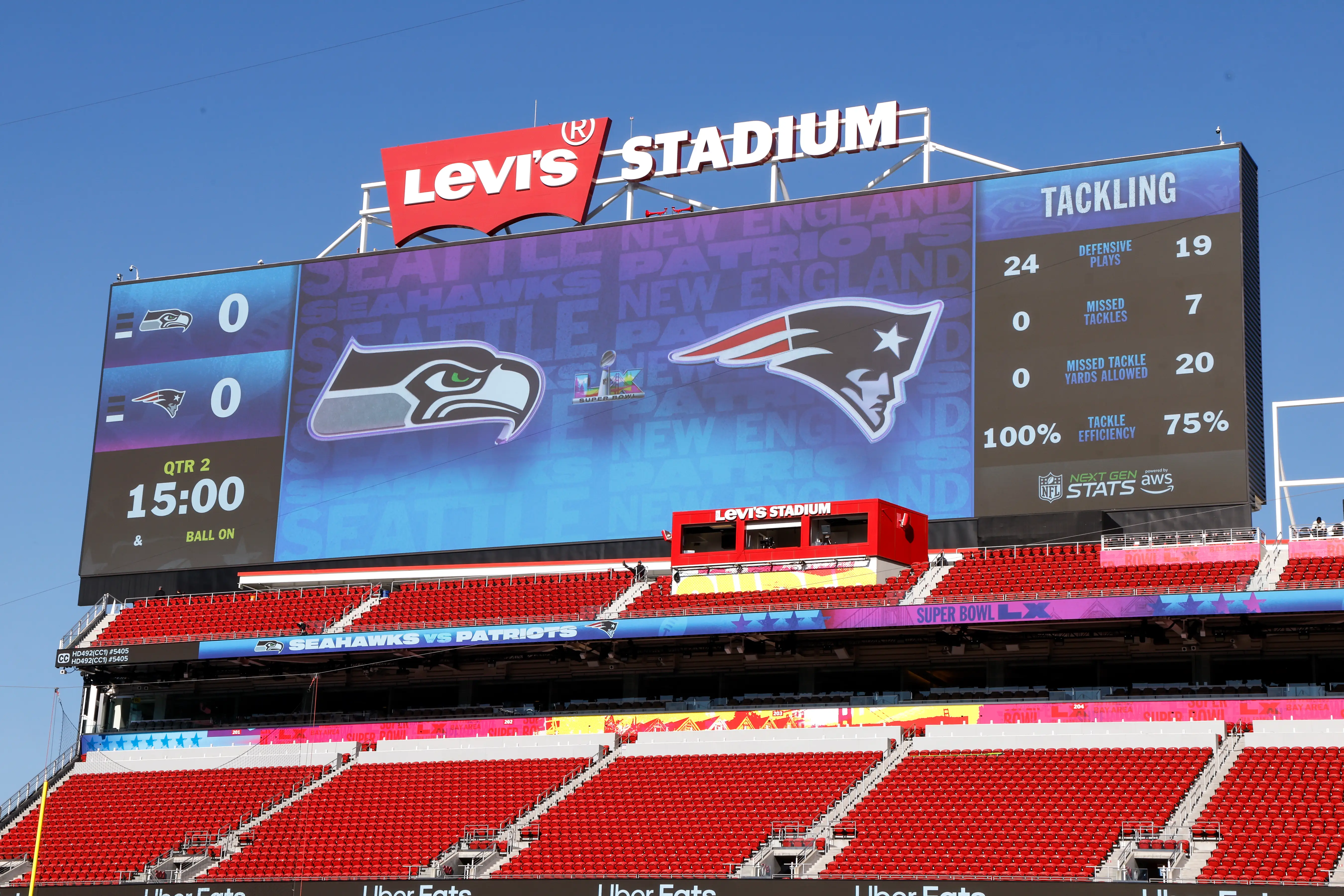 A big screen at Levi's Stadium displays the logos of the Seattle Seahawks and the New England Patriots.