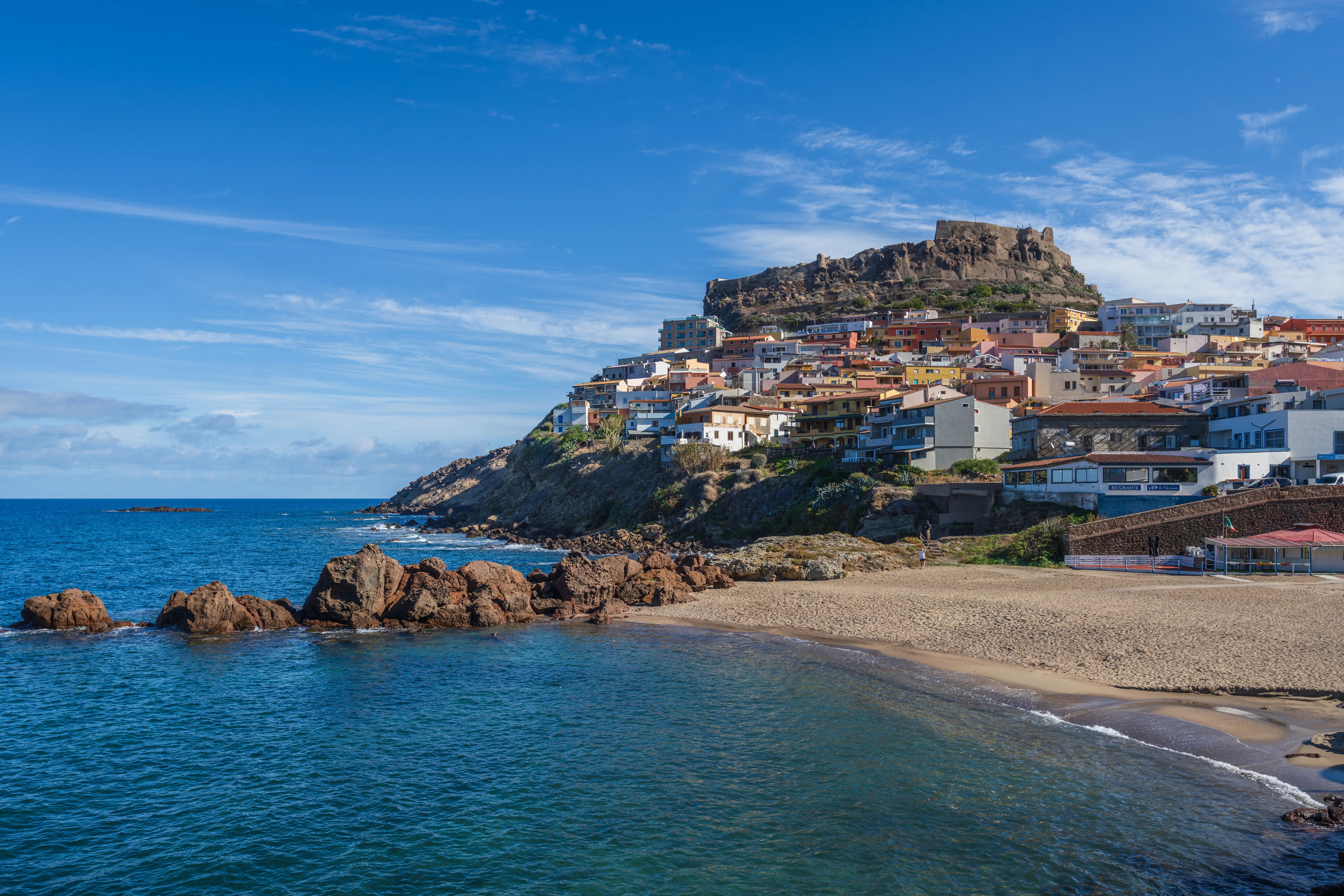 a seaside town on mountainous terrain in Sardinia Italy