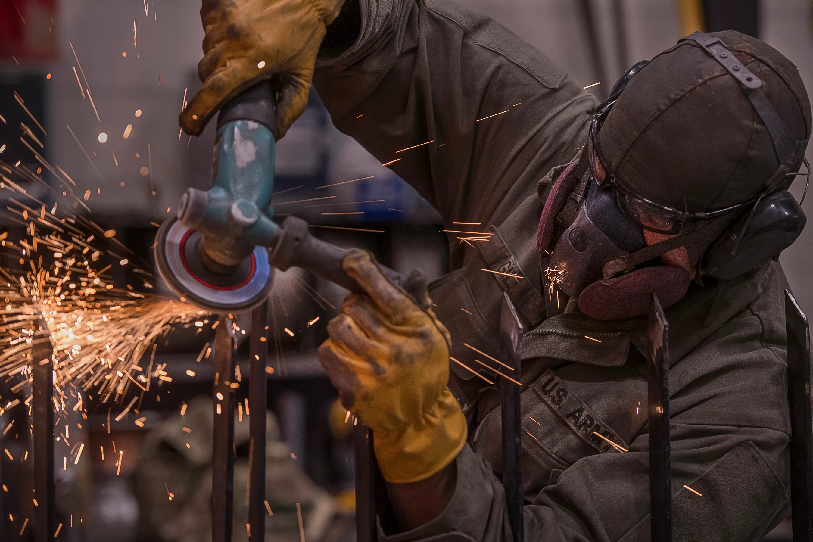 A National Guard soldier repairs a forklift.