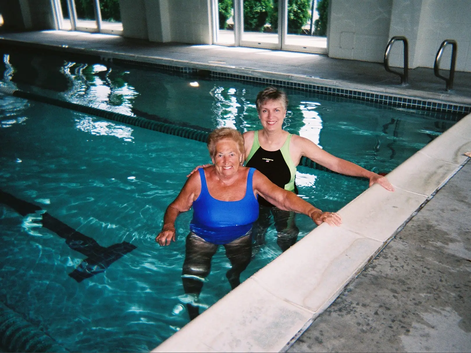 Cynthia Wall in the pool at her gym with a friend
