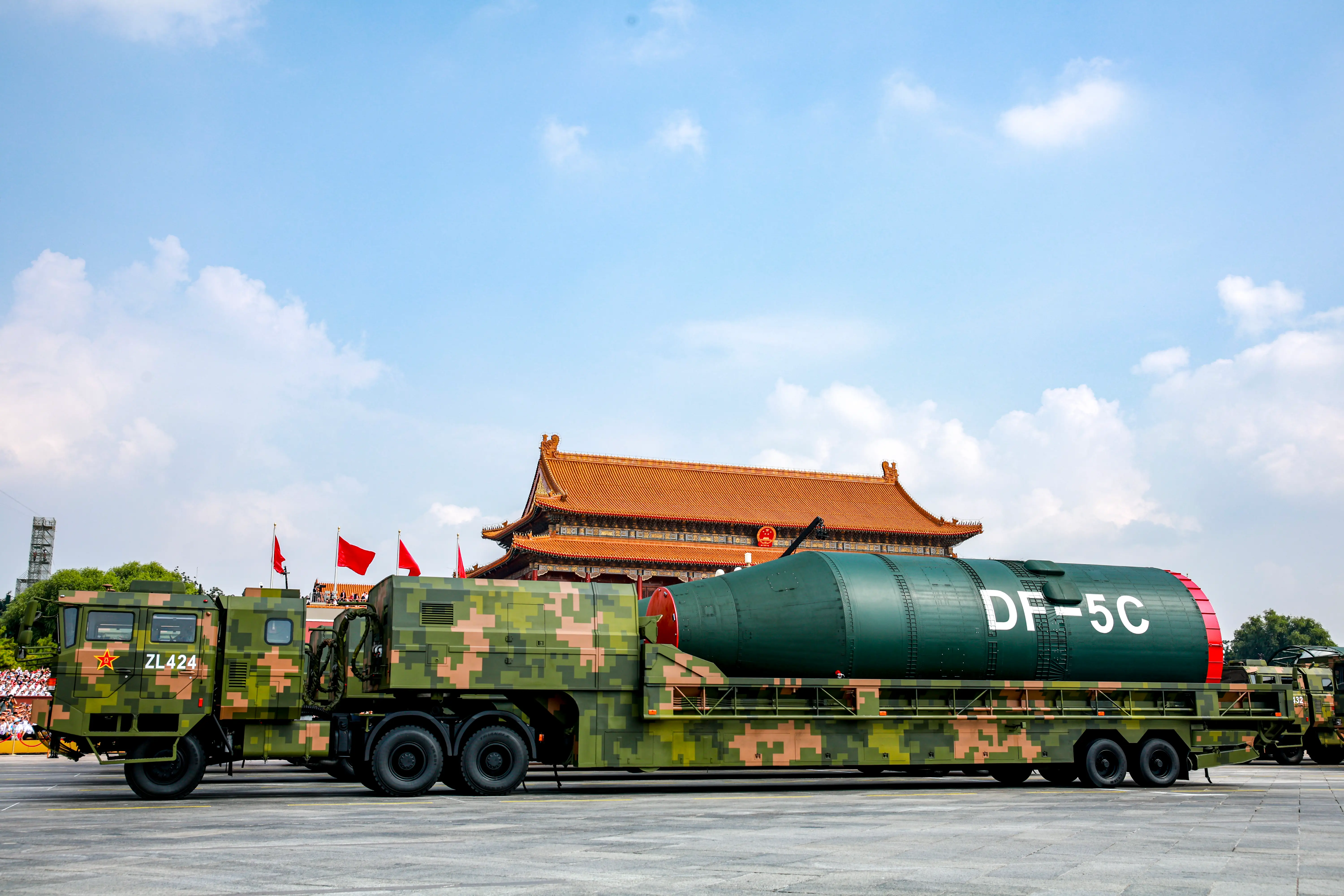 Chinese missiles sit on trucks.