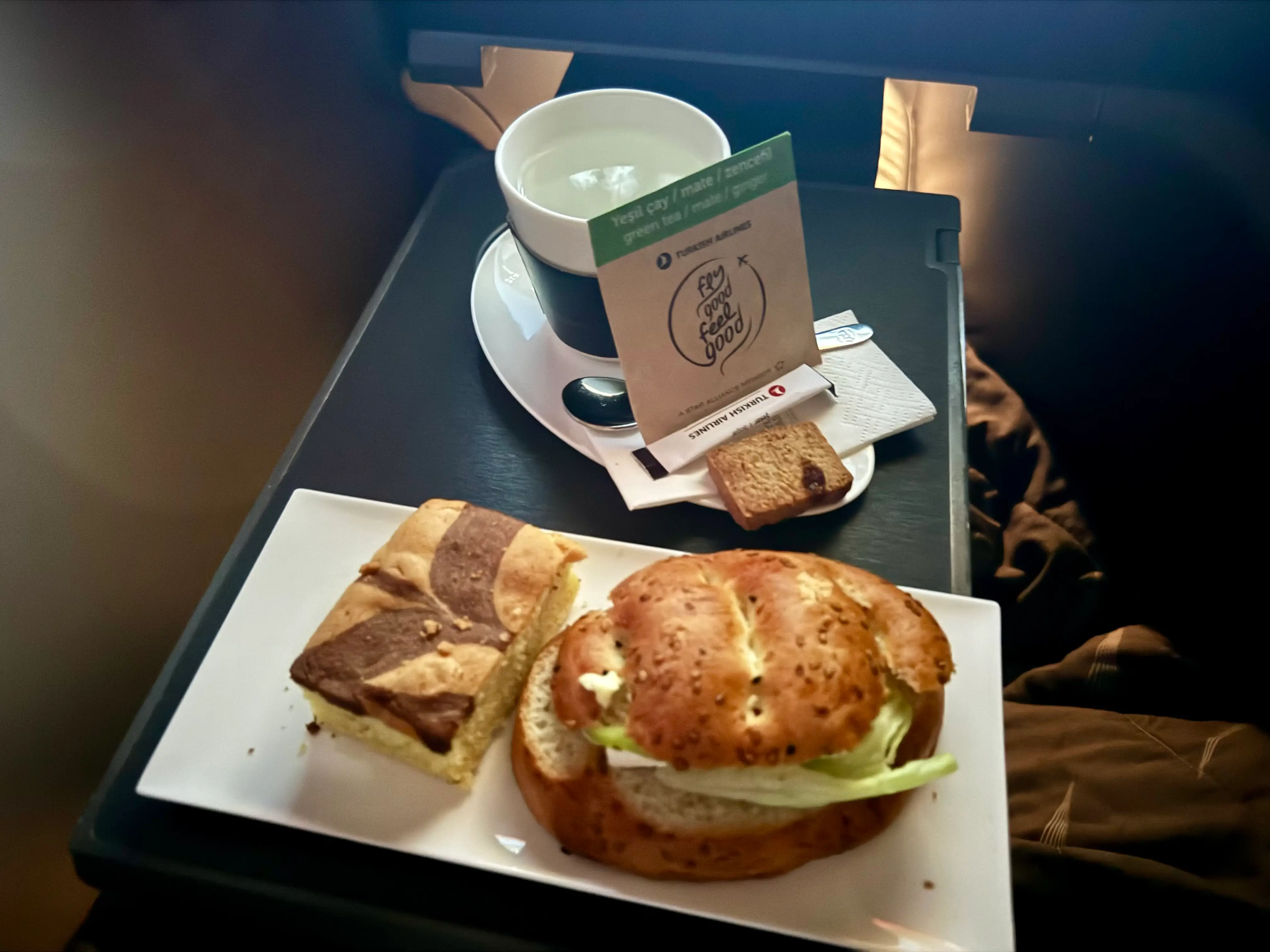 The simple sandwich and tea and pastry.