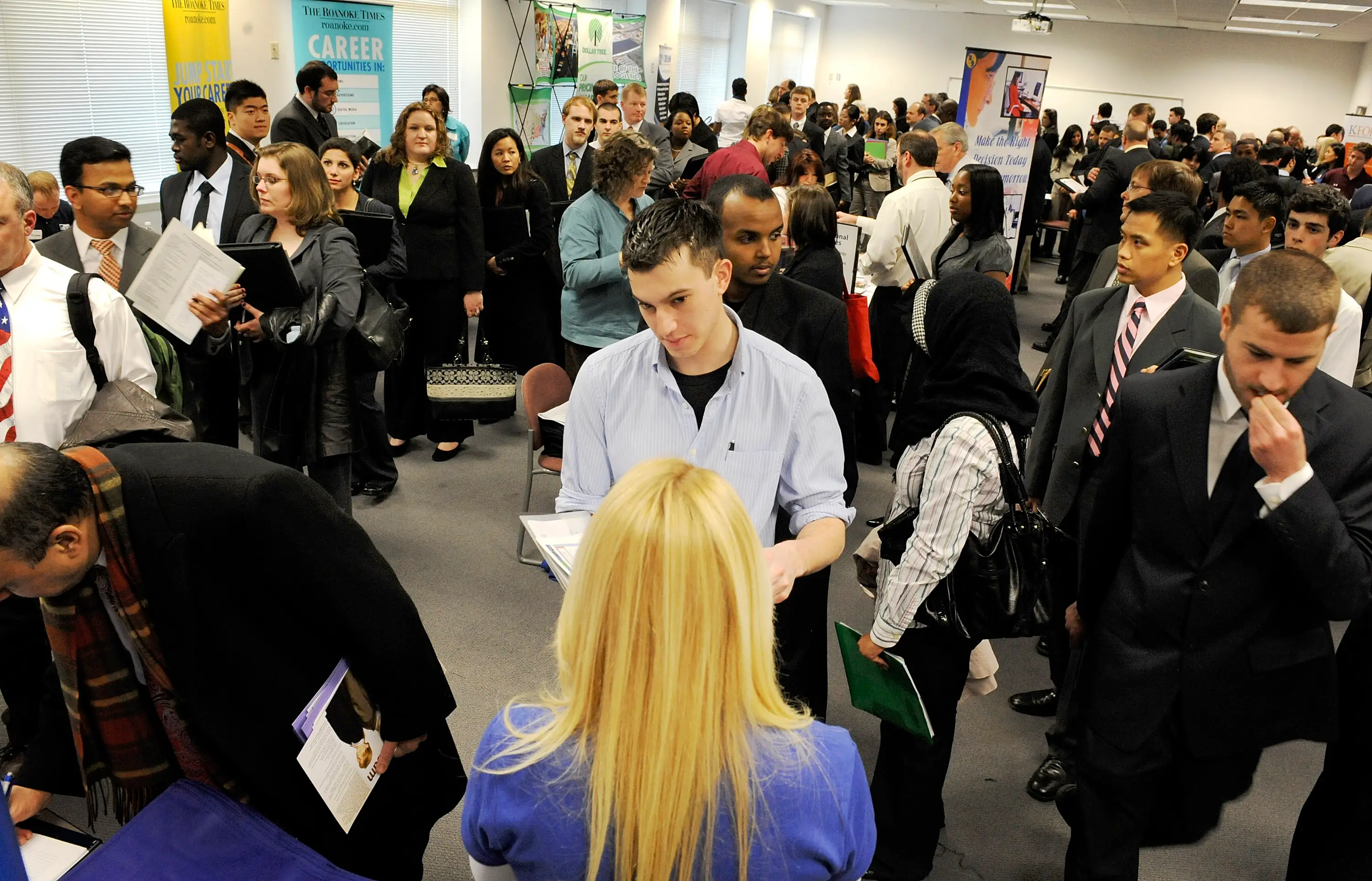 People attend a job fair