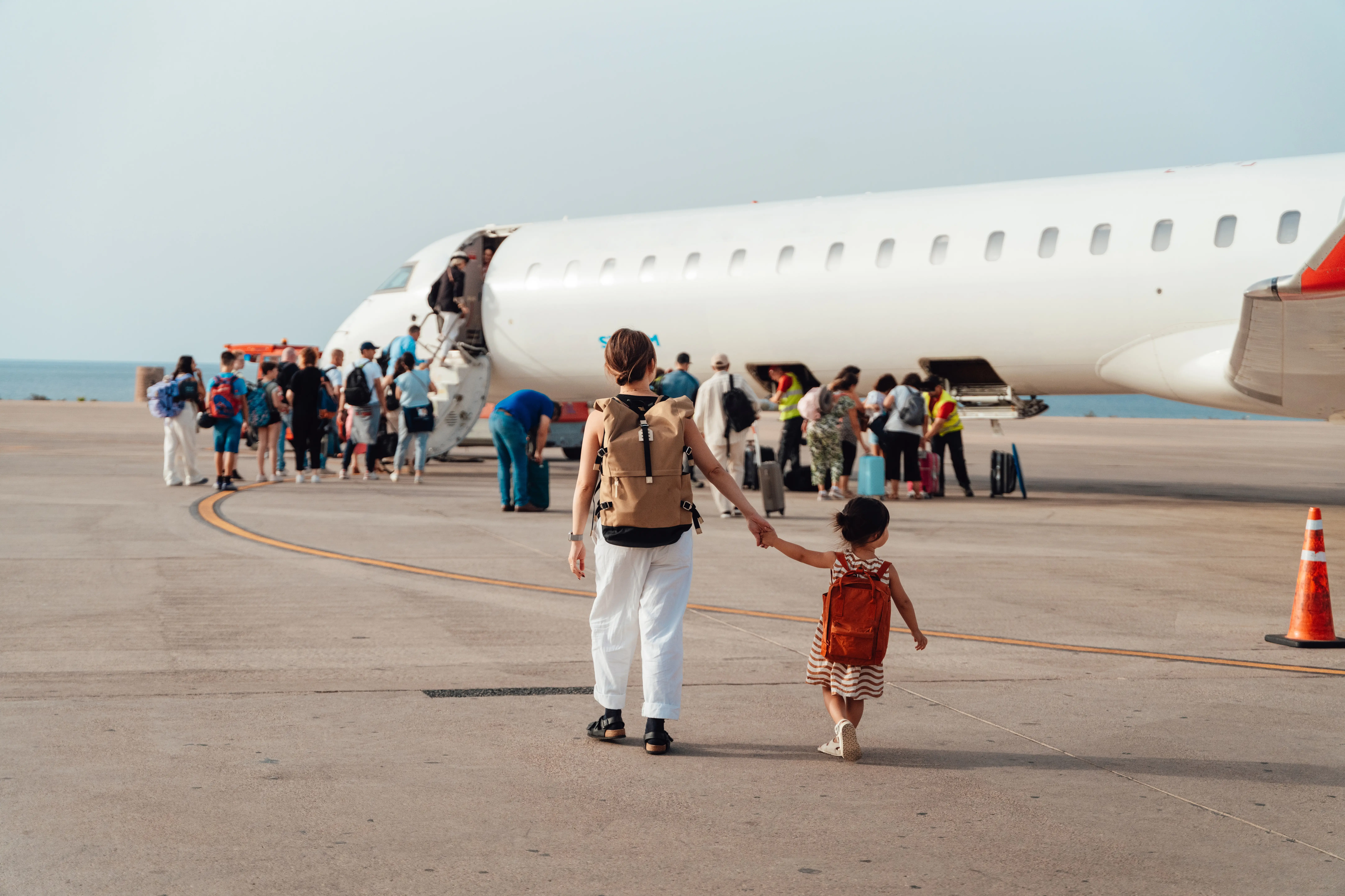 parent and child boarding plane