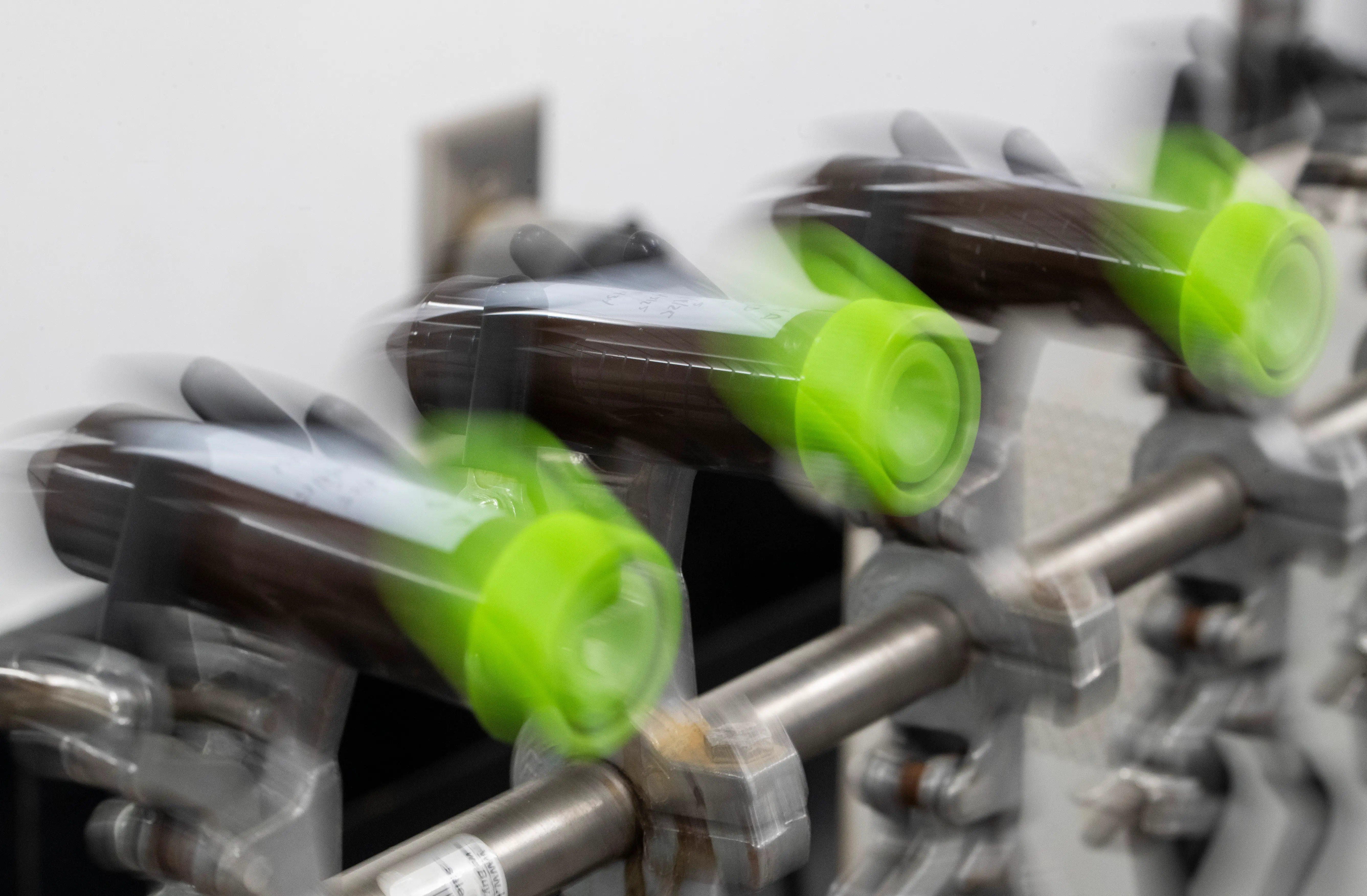 A machine repeatedly shakes bottles back and forth inside the labs at Thorne's manufacturing facility, Friday, September 5, 2025, in Summerville.