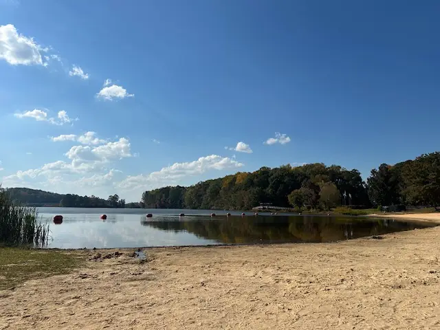 Body of water with sand around it