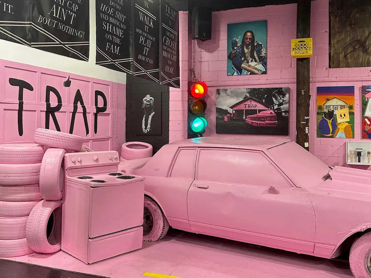 Pink-covered car, tires on display at TRAP museum