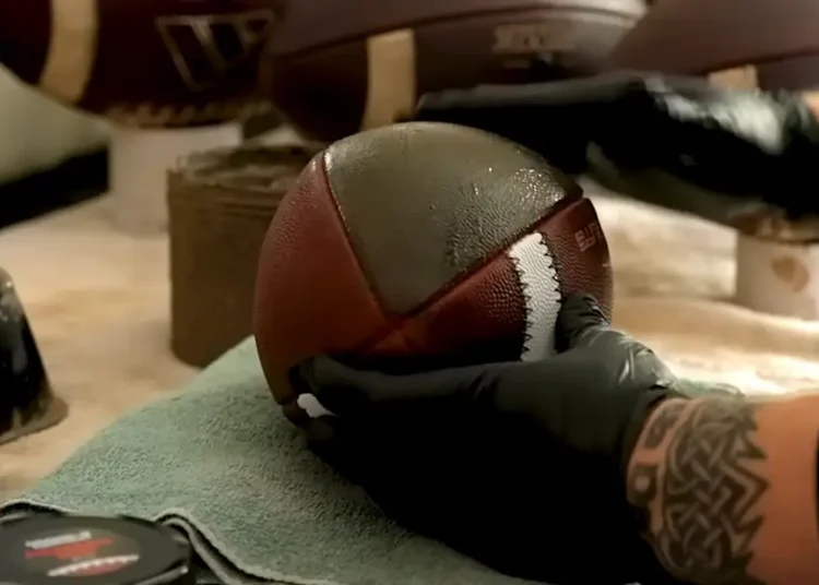 I got let go from my job. Now, NFL and college teams pay me for my muddy footballs.