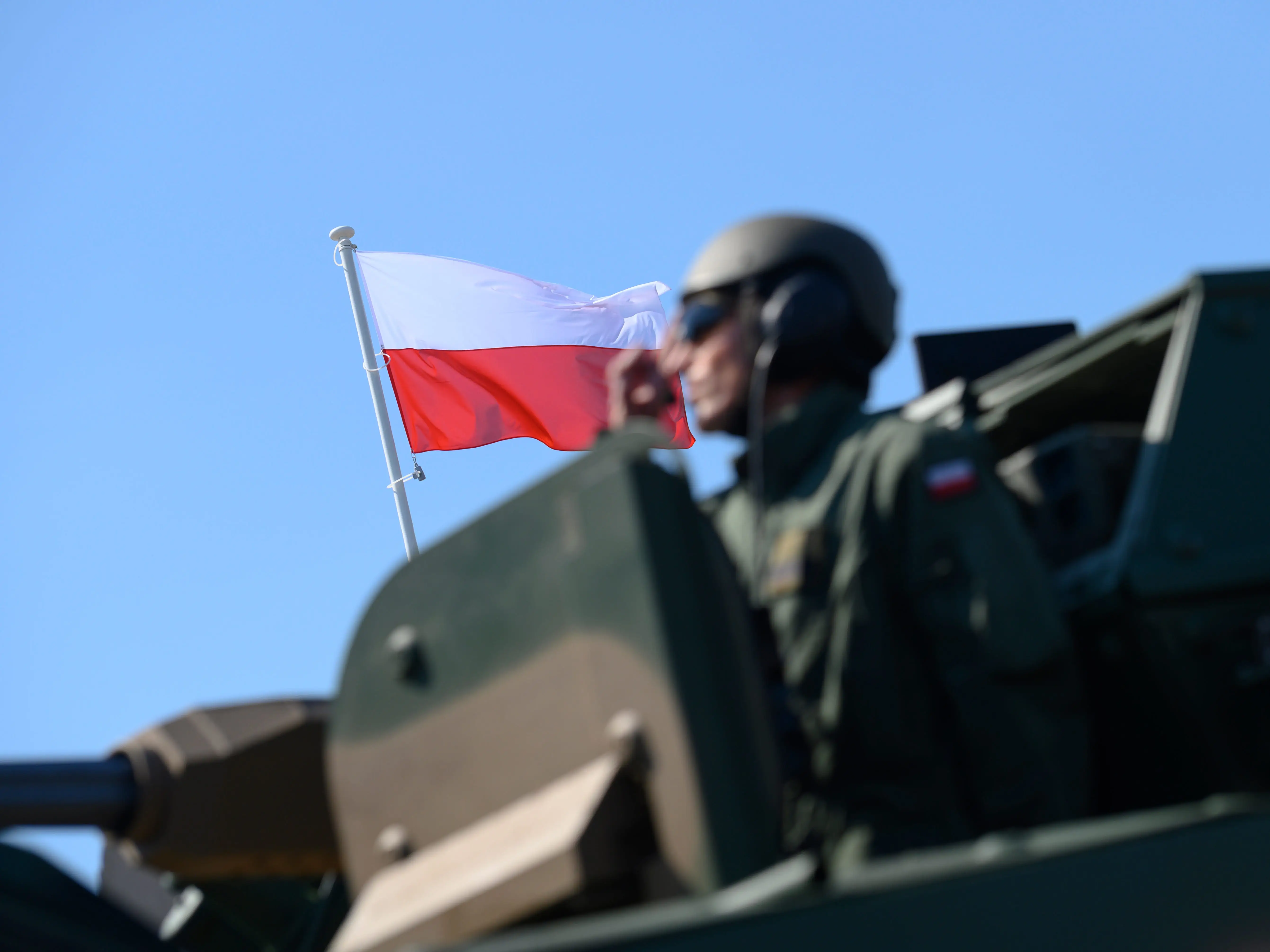Soldiers of the Polish Armed Forces ride a battle tank