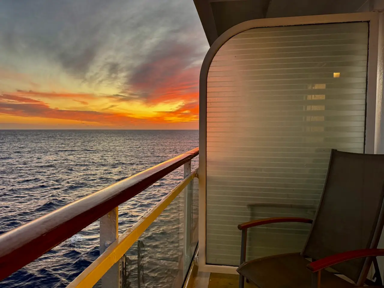 Sunset view off of balcony cabin on on Celebrity Constellation
