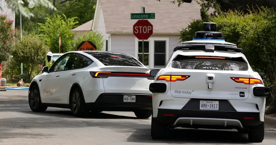 Tesla says its cars should drive themselves as humans do. Waymo says the bar is higher.