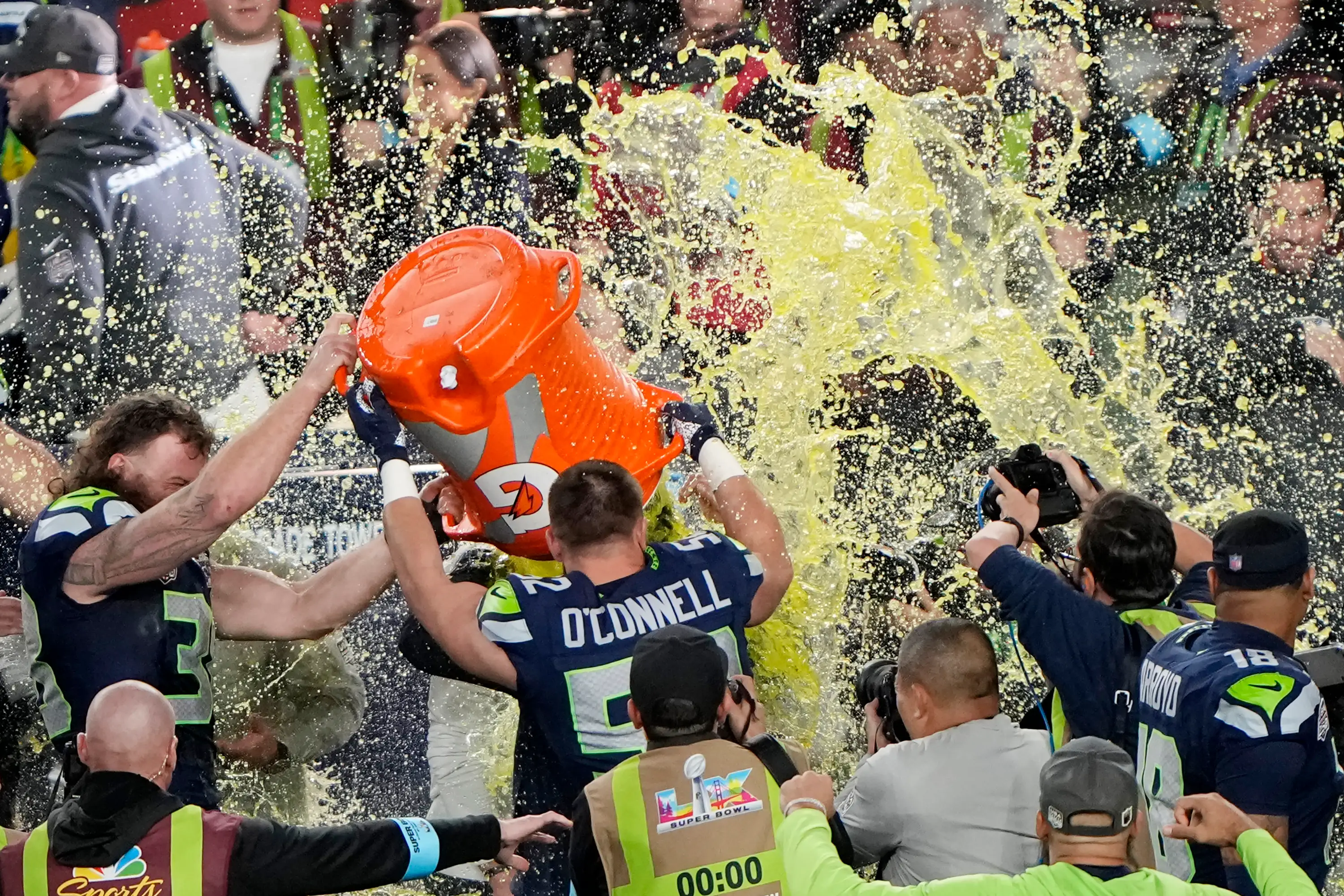 Head coach Mike MacDonald of the Seattle Seahawks is doused with Gatorade by Patrick O'Connell.