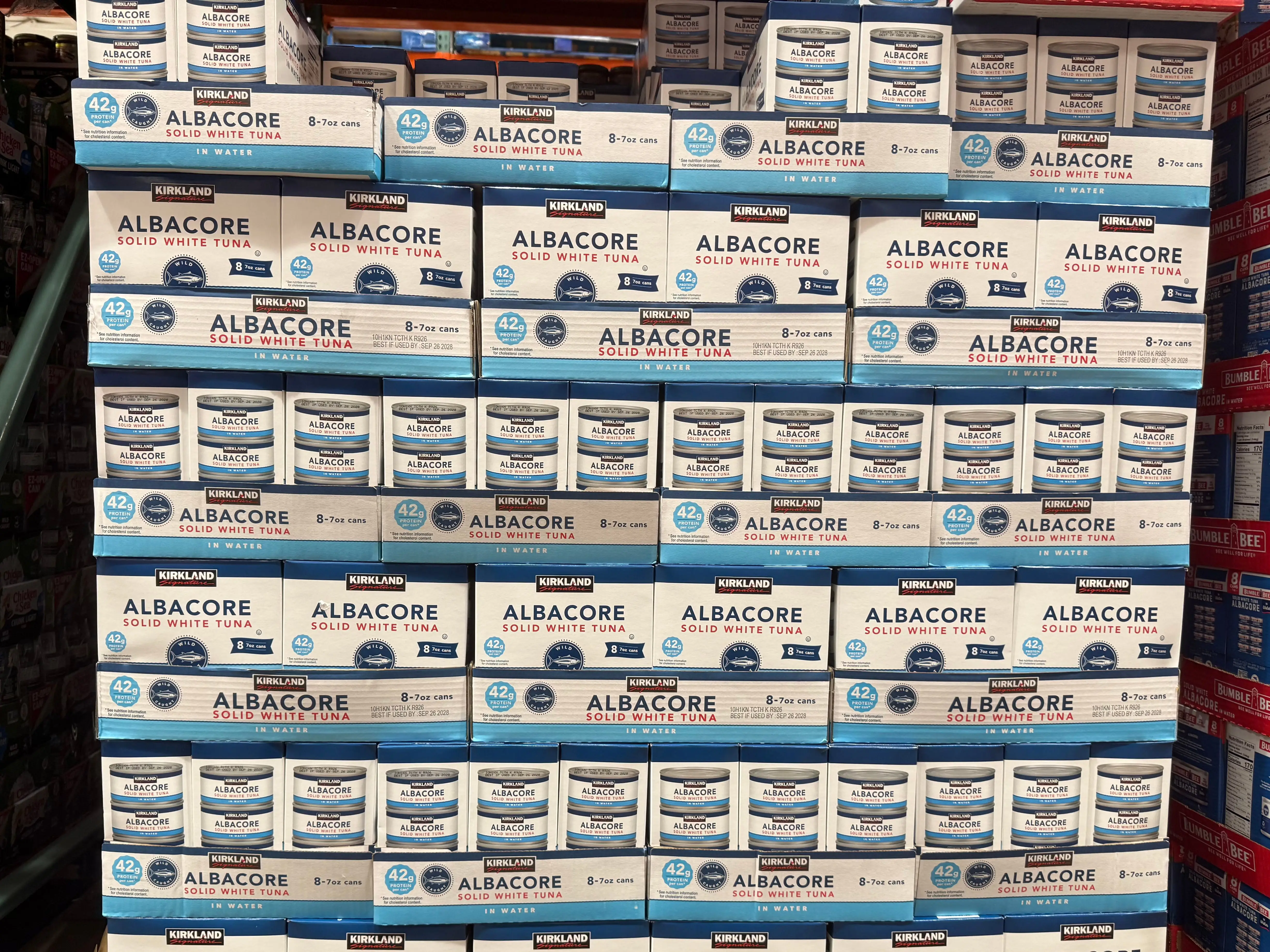 Boxes of Kirkland Signature Albacore tuna on display at Costco.