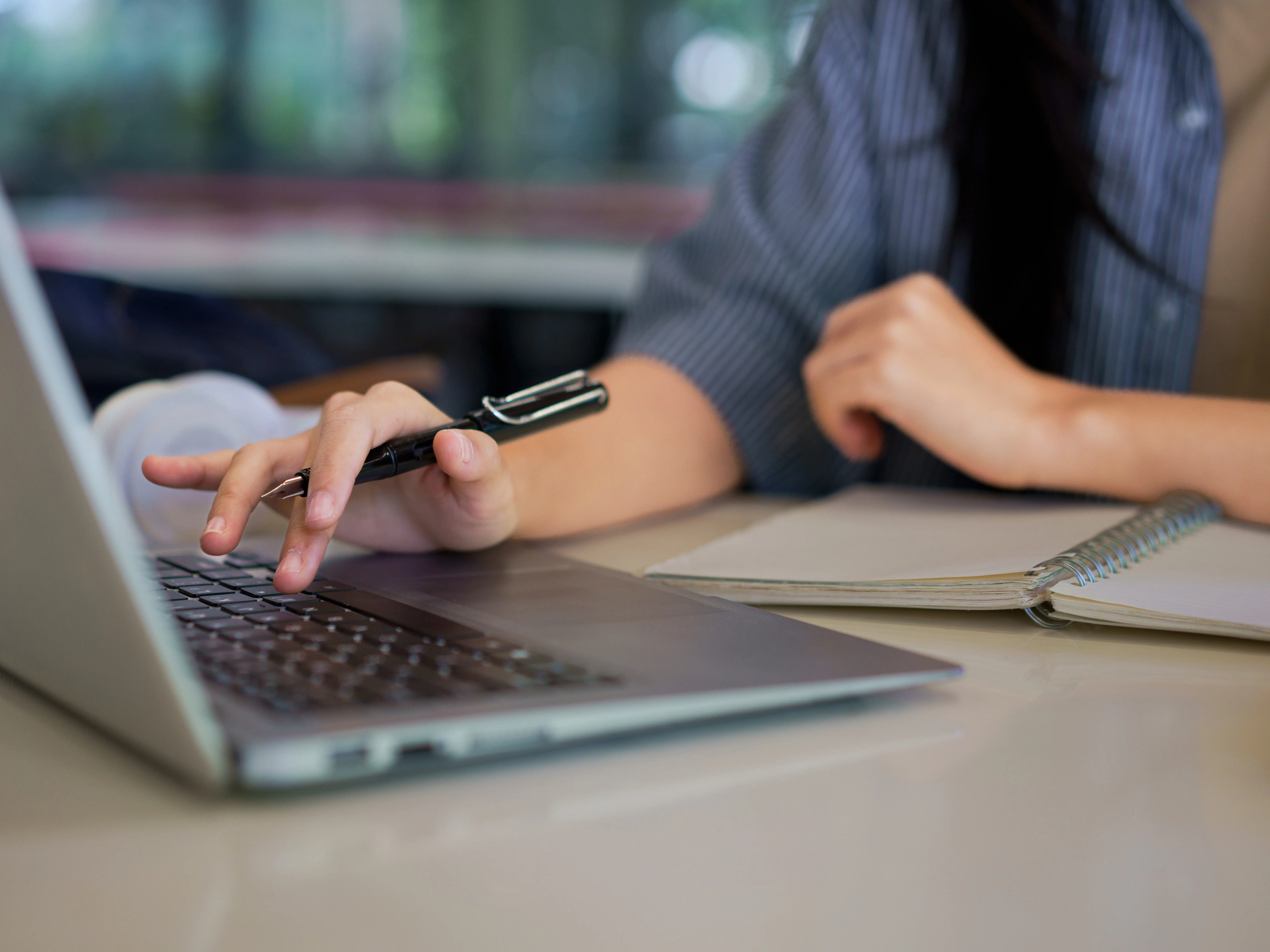 a student typing on a computer