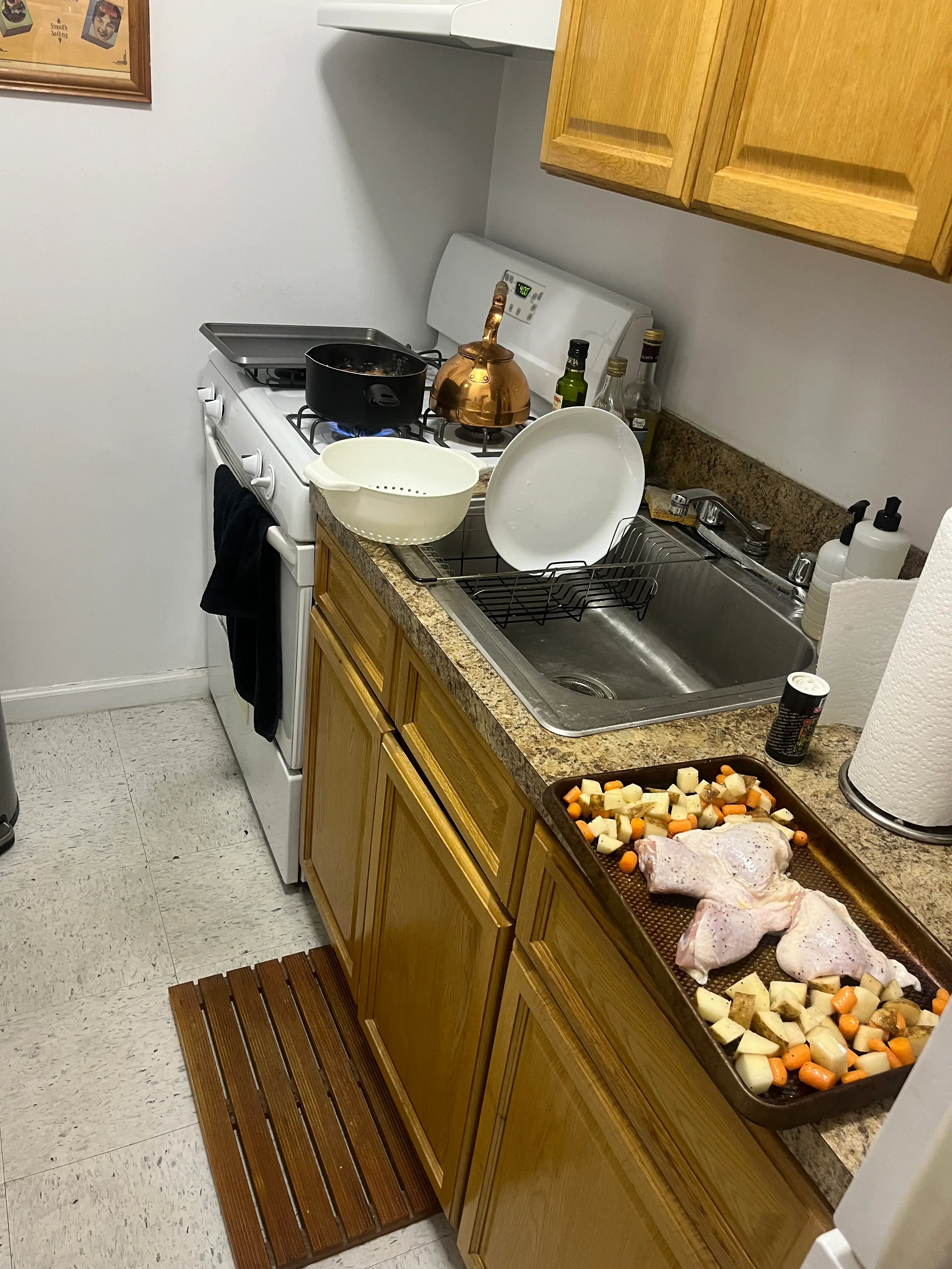 Chicken and potatoes being prepared in a kitchen