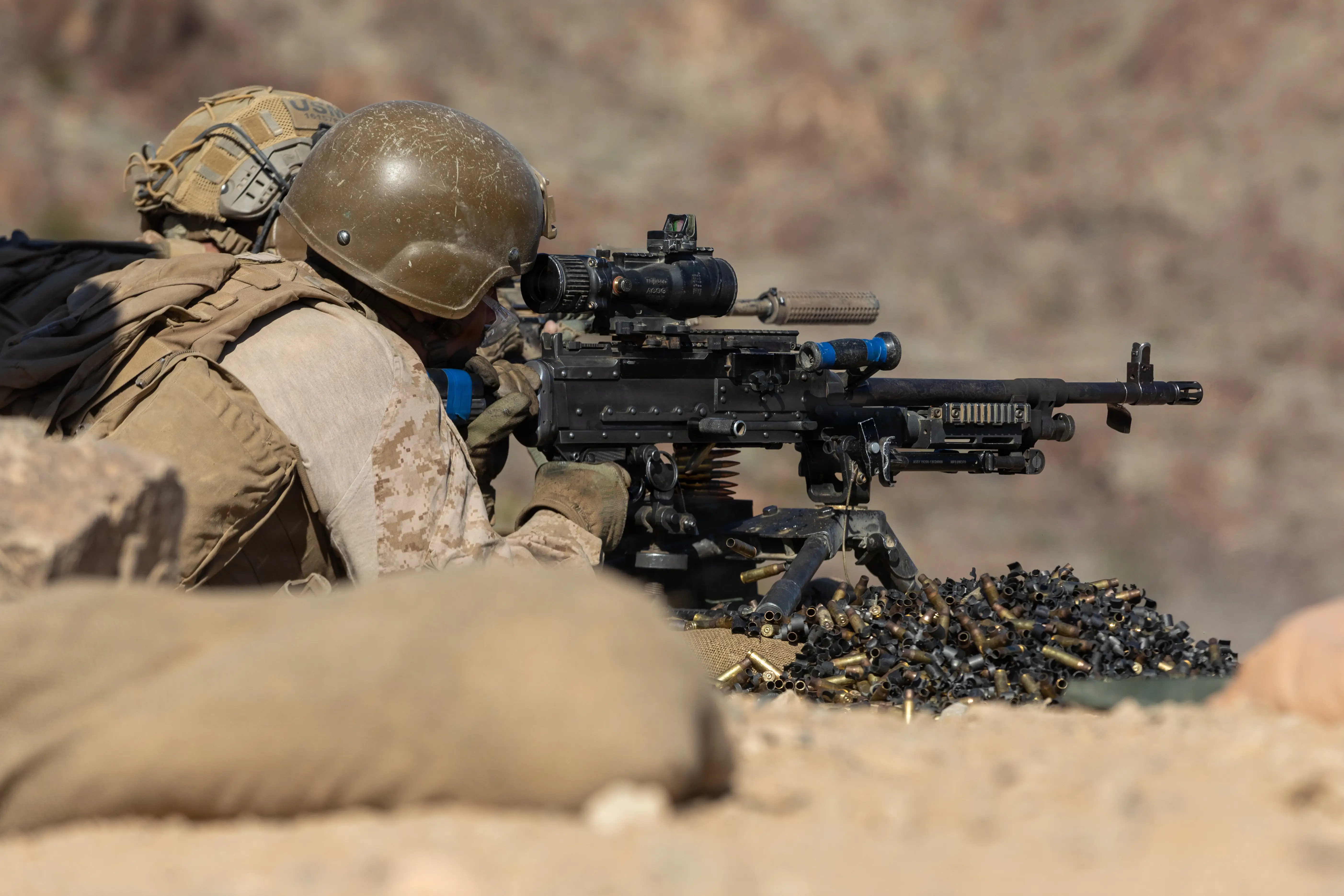 Marines firing an M240