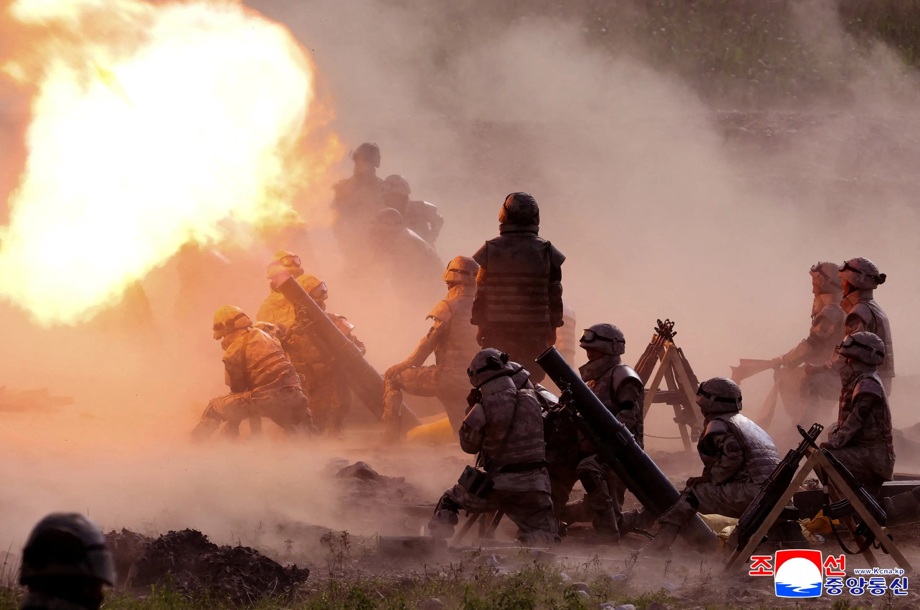 Members of the tactical artillery units under the large combined units of the Korean People's Army take part in a shooting training competition, at an unknown location, in this handout image released on August 12, 2025.