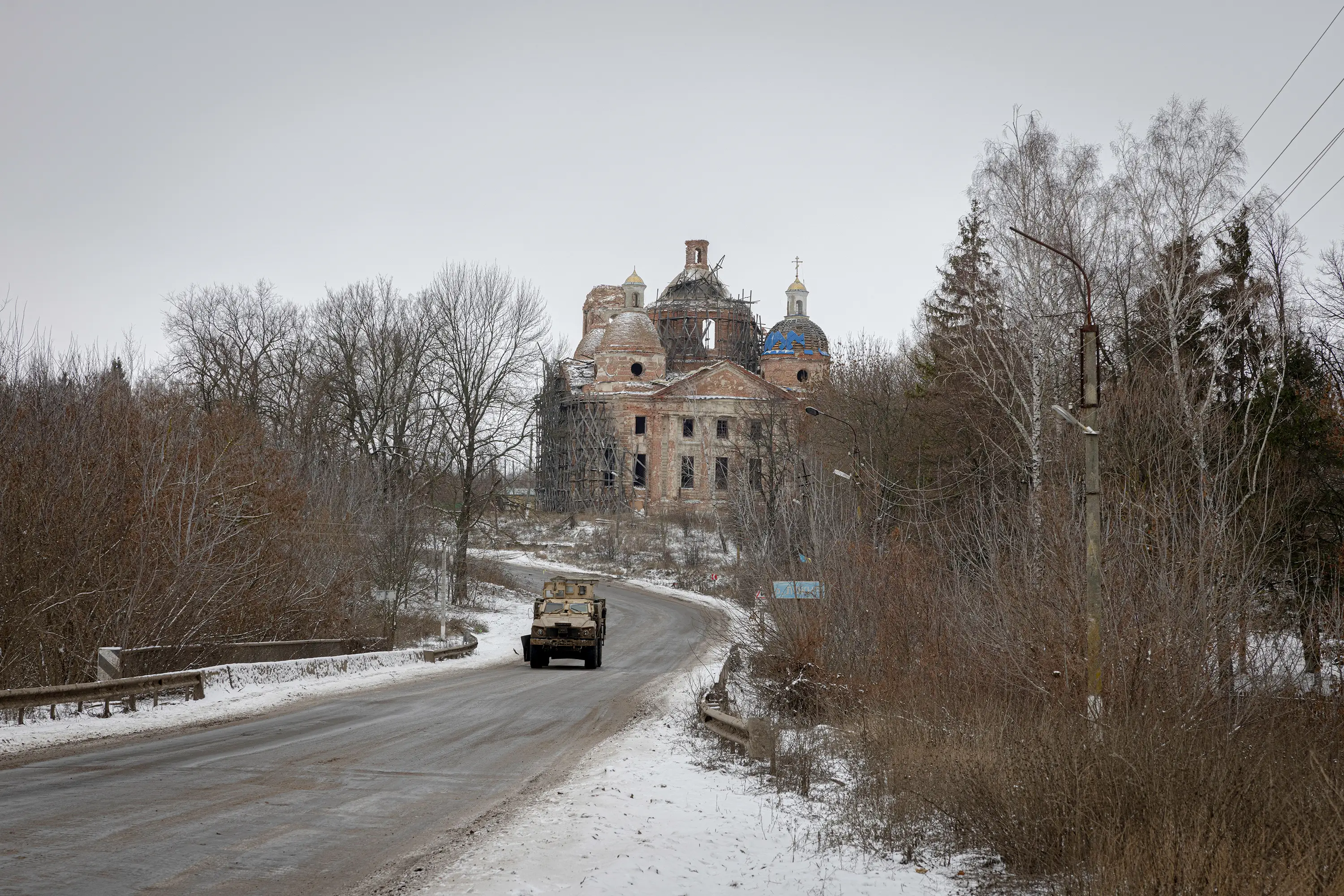An armored Ukrainian military vehicle coming from the direction of Ukraine's northeastern Sumy region heads toward the Russian border in December 2024.