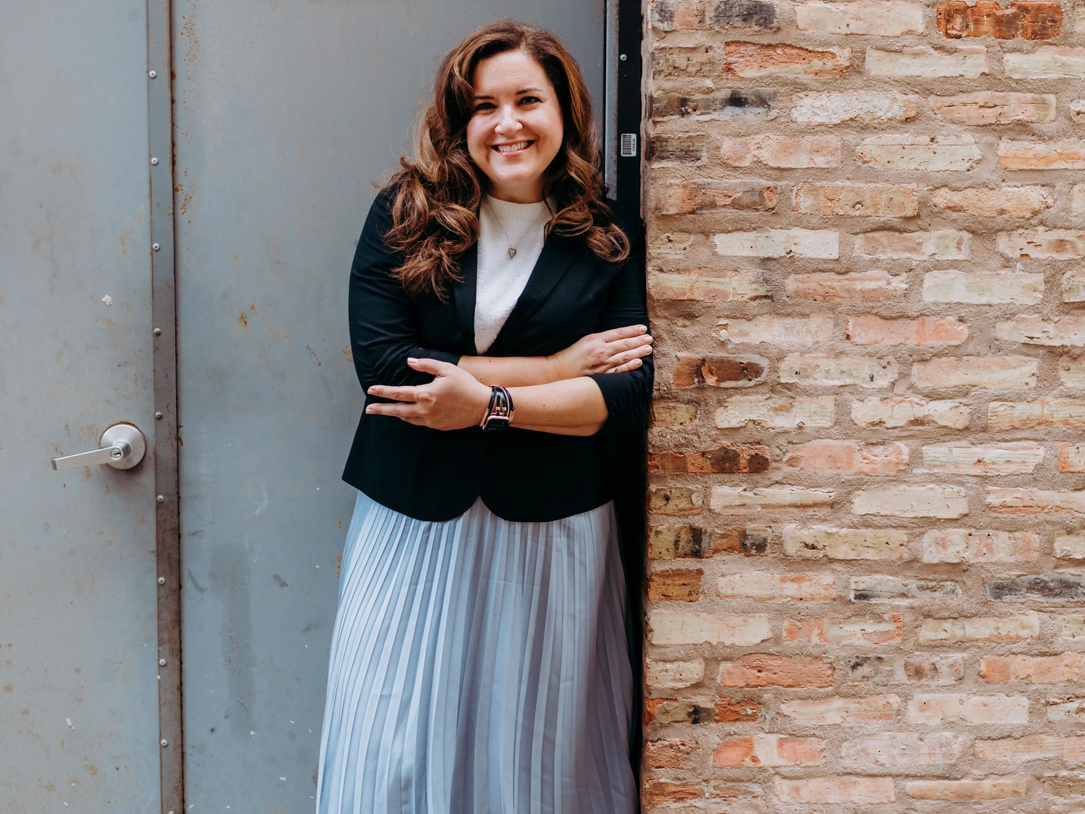 Andrea Javor posting for the camera in a blue dress