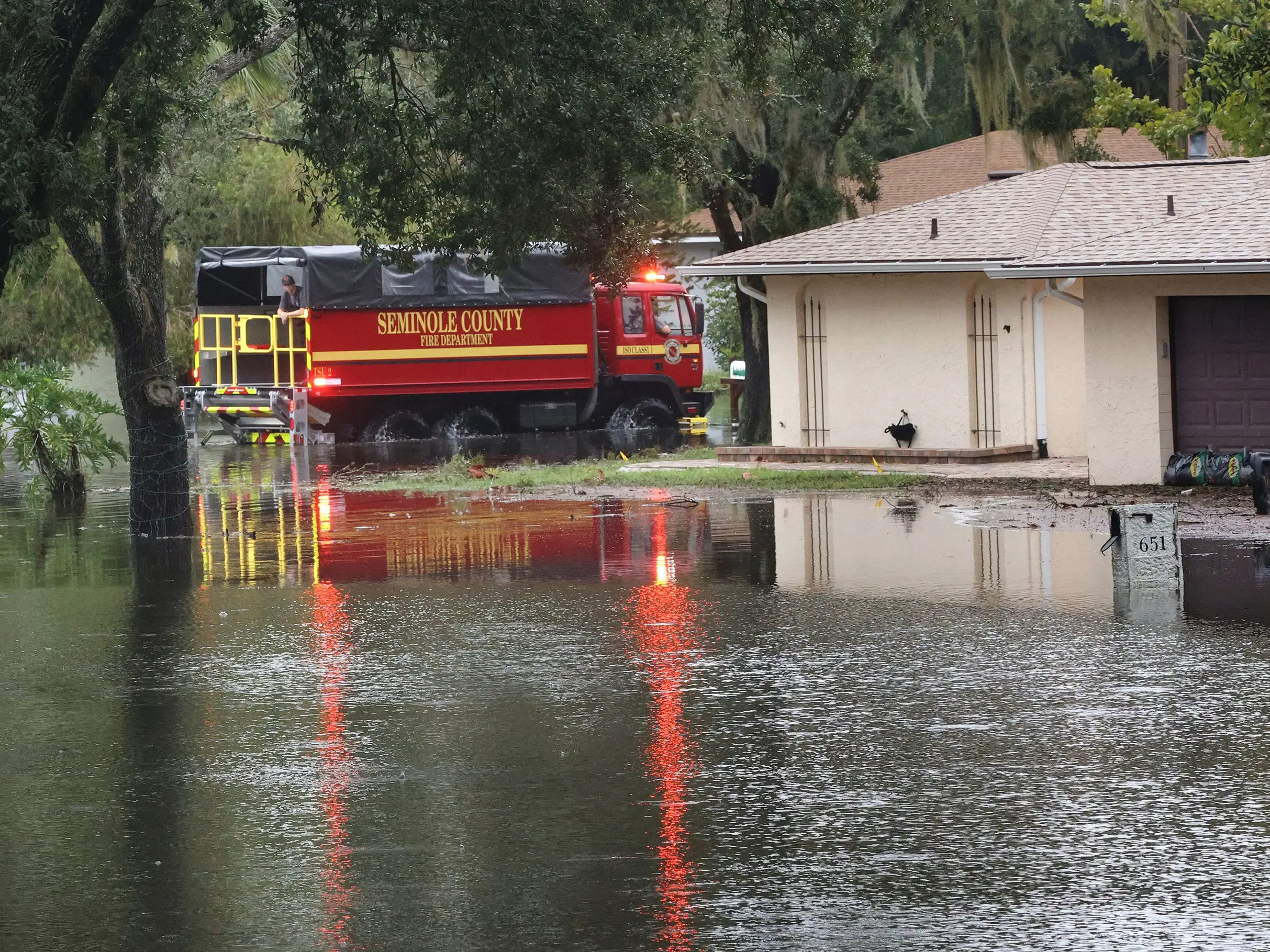 A firetruck drives through the streets of Altamonte Springs, Florida, in the aftermath of Hurricane Milton.