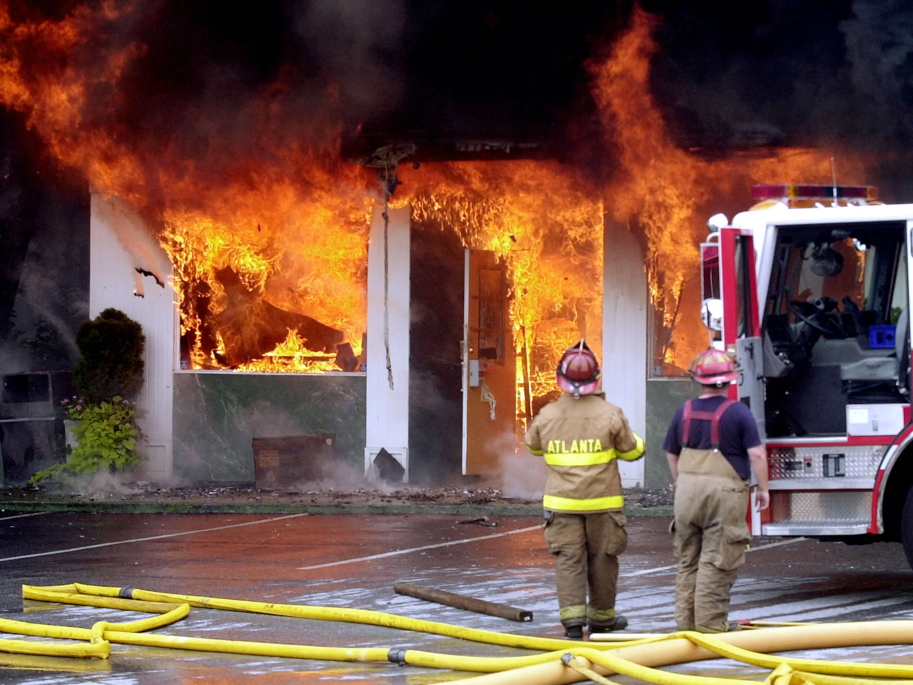 Firefighters watch as an antiques mall burns in Atlanta, Georgia.