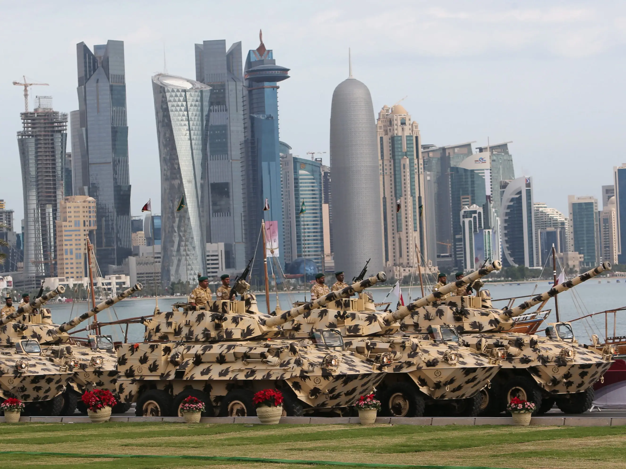 A general view show armoured vehicles rolling during the military parade marking the Gulf emirate's National Day celebrations in Doha on December 18, 2012