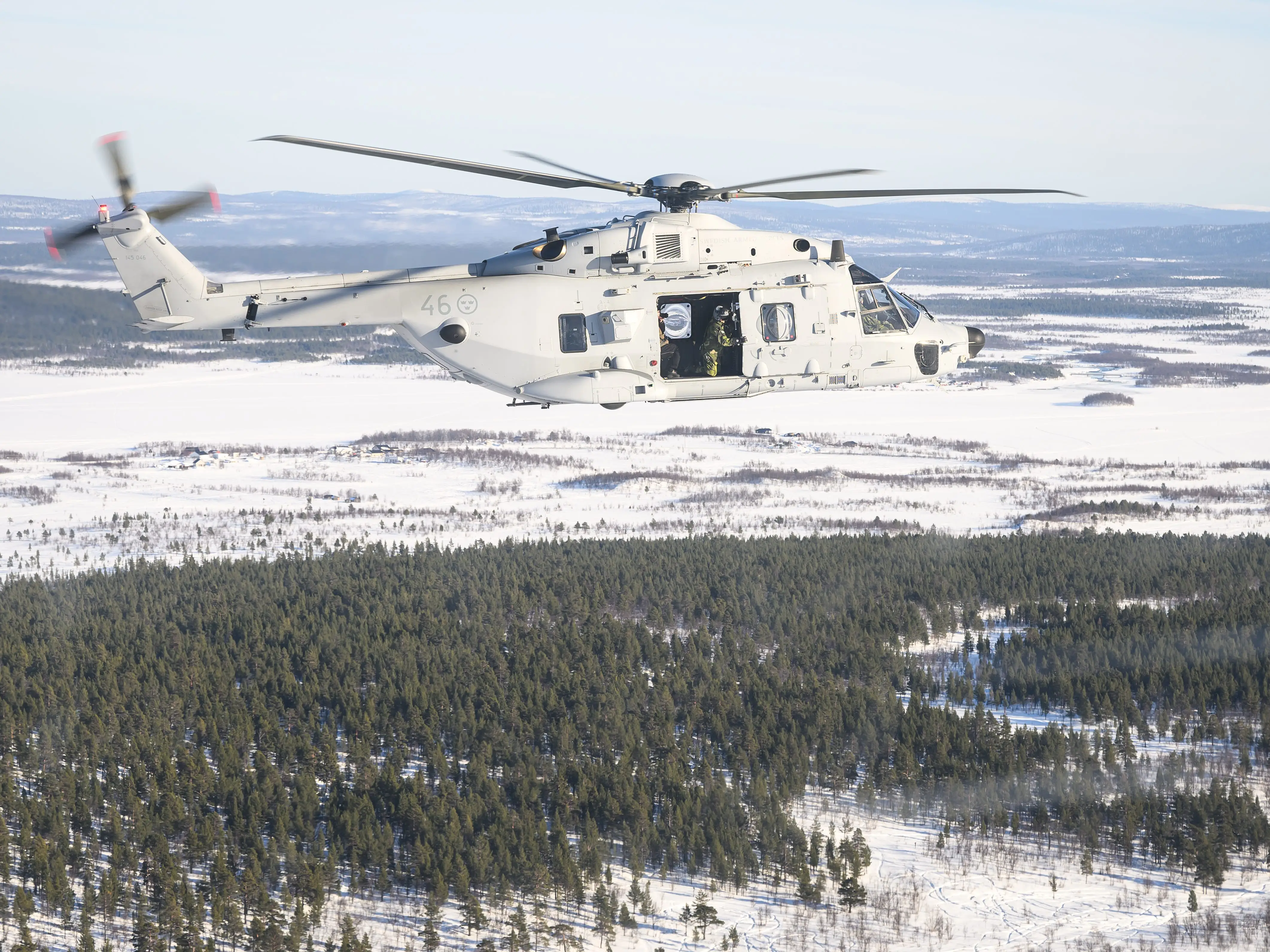 An NH90 helicopter is seen in flight after departing from a temporary base during the Nordic Response military exercise on March 07, 2024 in Kiruna, Sweden. The exercise, which primarily takes place across Scandinavia from March 3-14, features 20,000 troops from 13 allied countries. Following the recent NATO expansion, the group now includes Finland and Sweden.