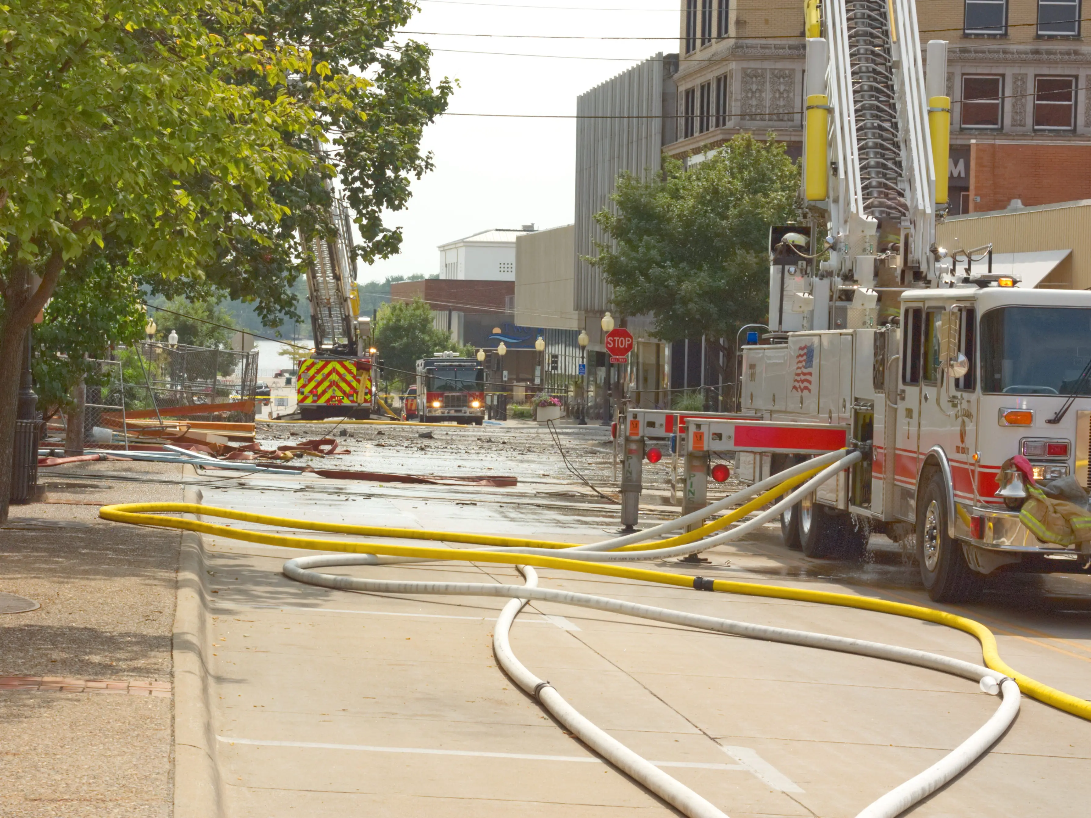 Hoses attached to firetrucks after an emergency response in Burlington, Iowa.