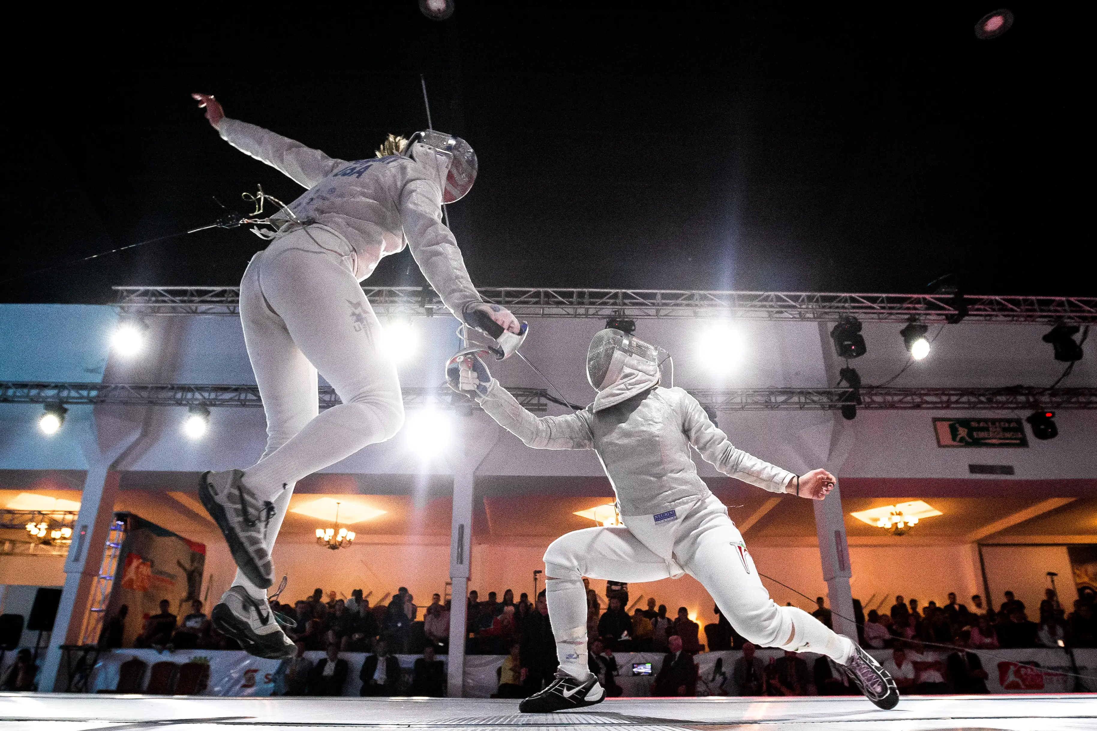 Monica Aksamit of the USA leaps into the air while attacking Tania Arrayales of Mexico