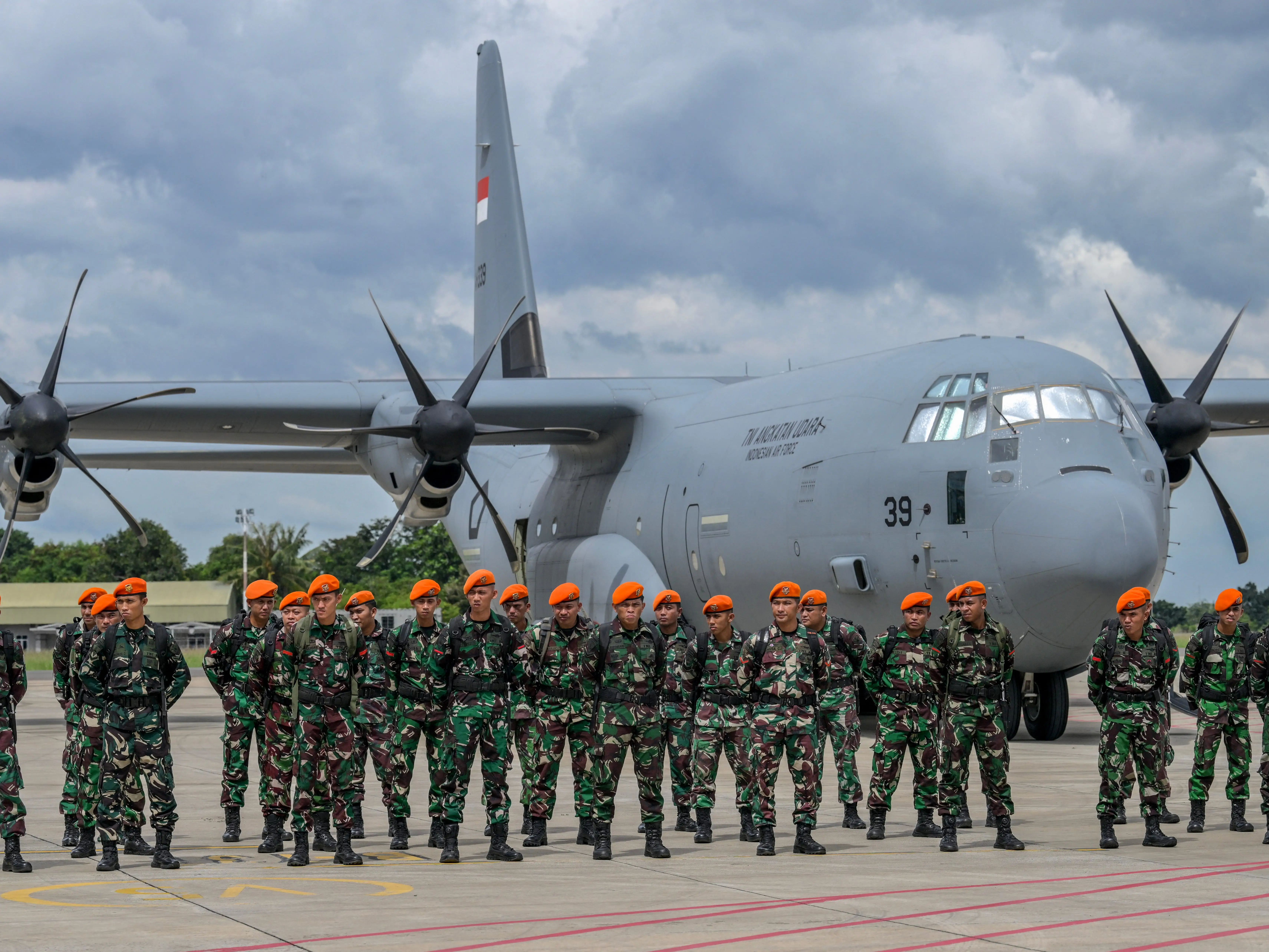 Indonesian National Armed Forces troops stand in formation during preparations for deployment in Myanmar as part of the Indonesian government's relief mission to assist earthquake victims, at Halim Perdanakusuma Air Base in Jakarta on March 31, 2025