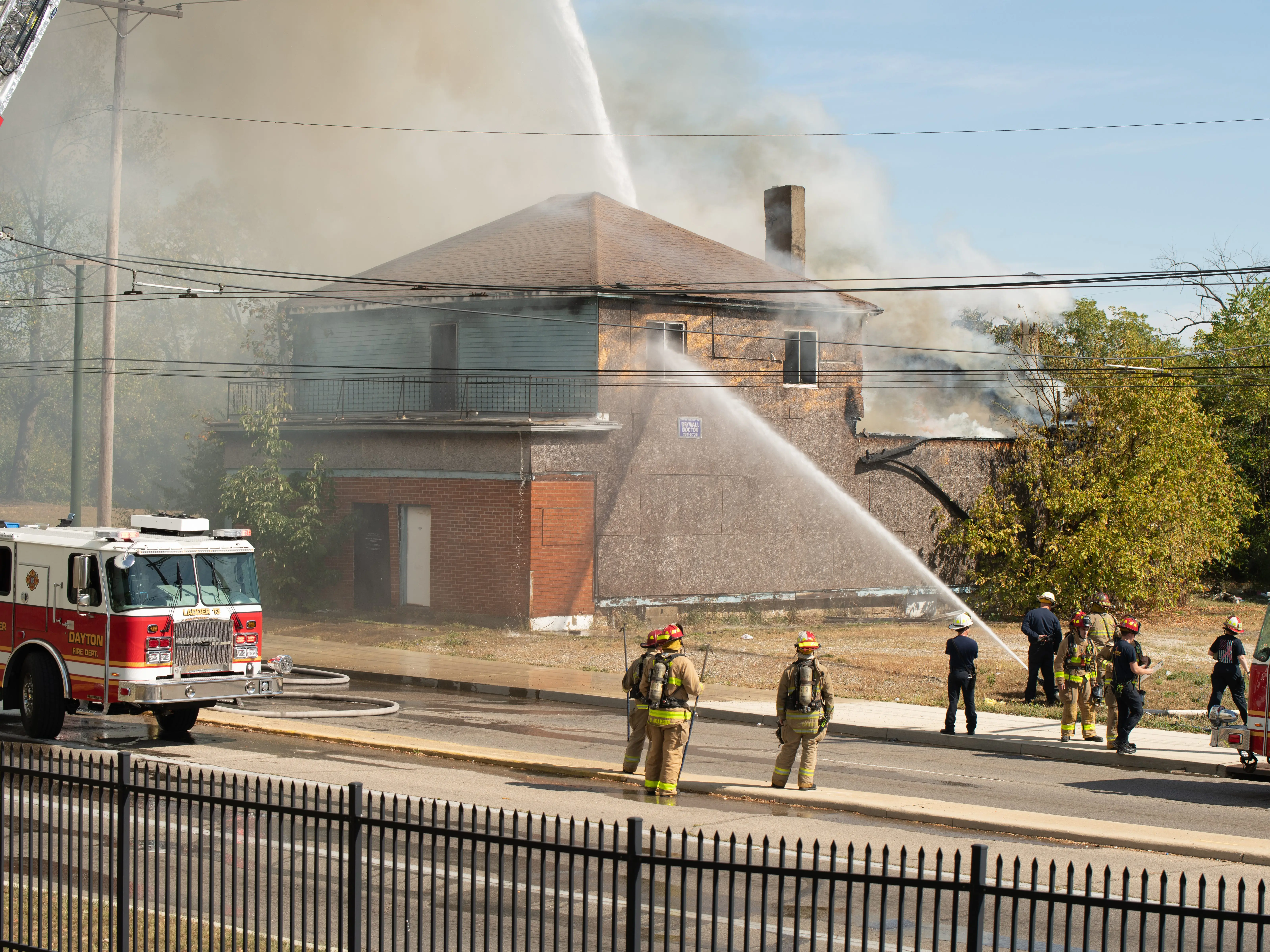 Firefighters hose down a house in Dayton, Ohio.