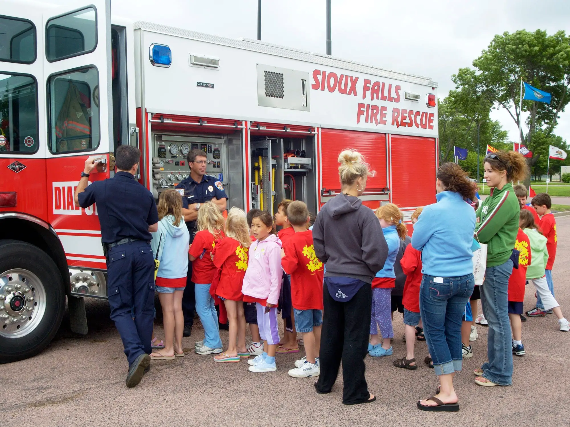 Children line up to view a firetruck in Sioux Falls, South Dakota.