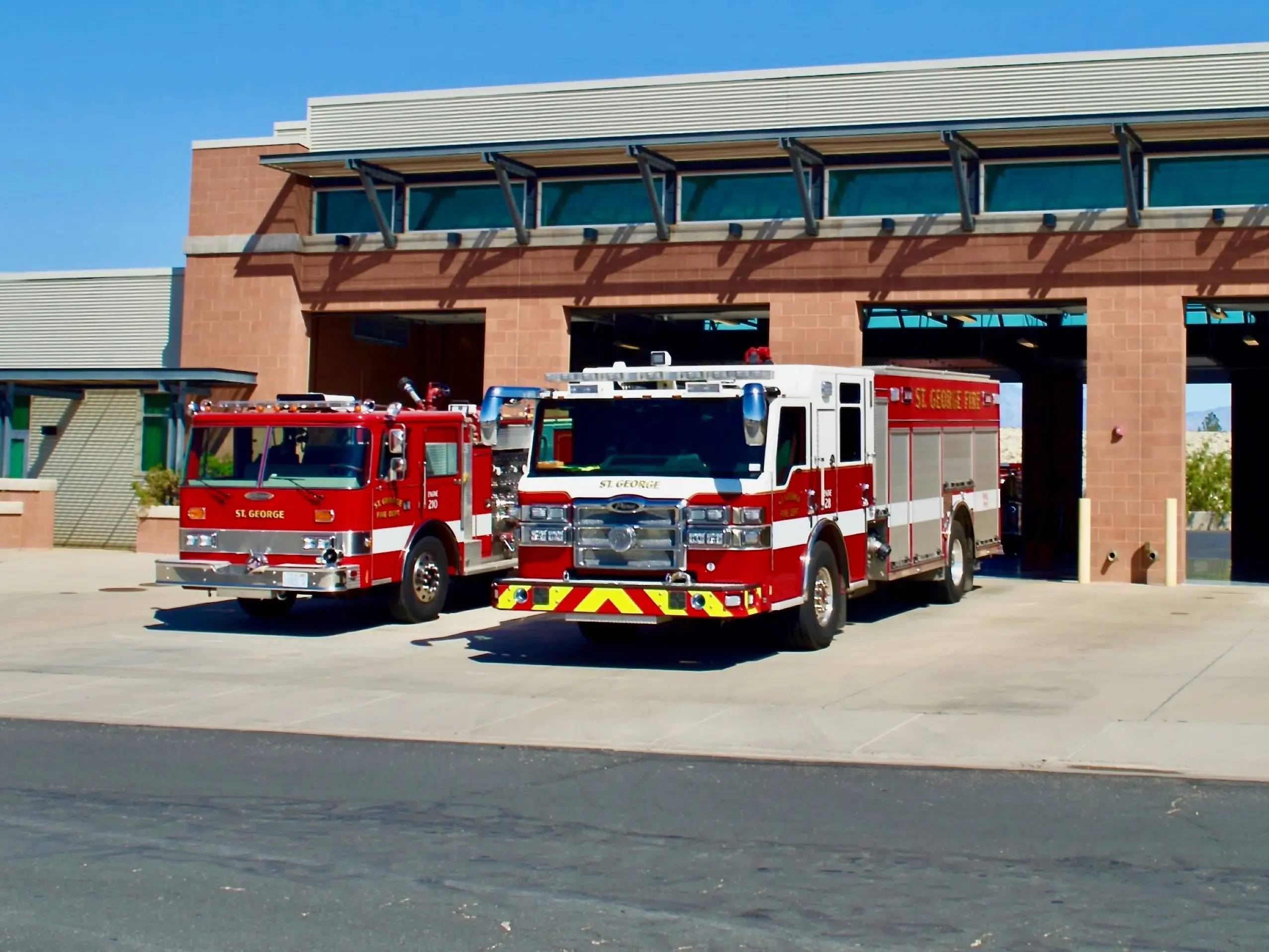 Two firetrucks at a station in Saint George, Utah.