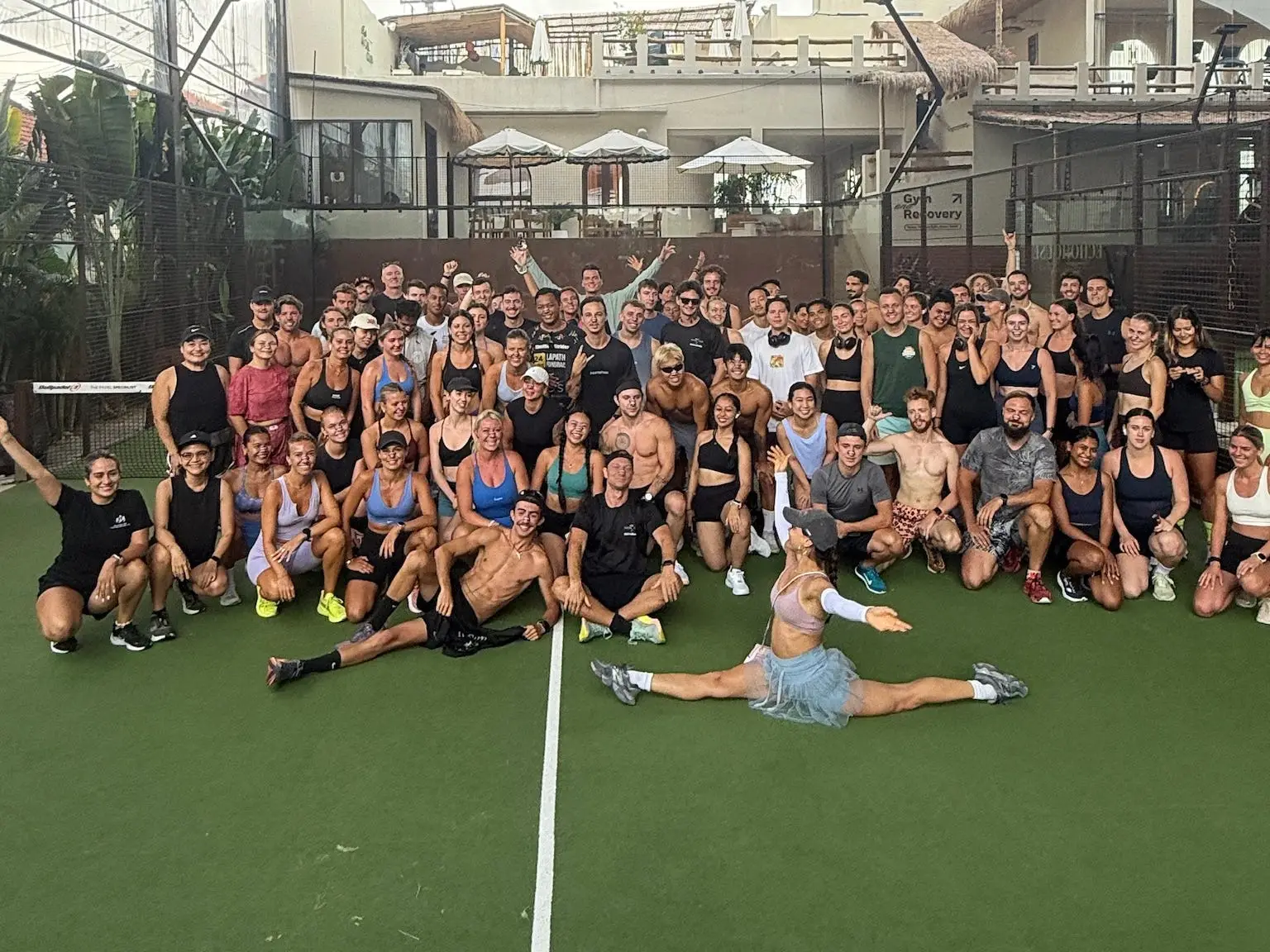 Group of people from the Entourage club in Bali posing.