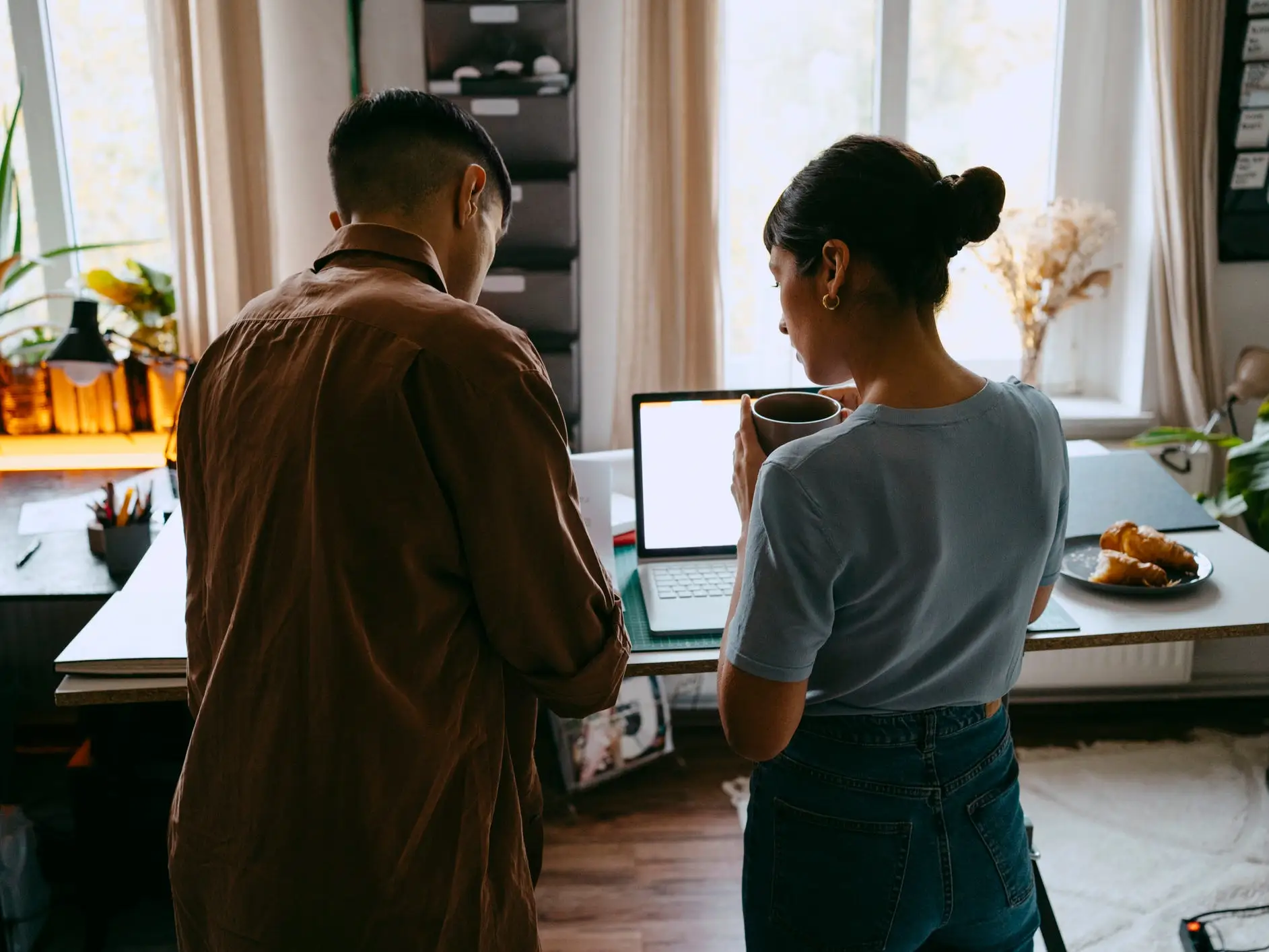 Couple in their home office.