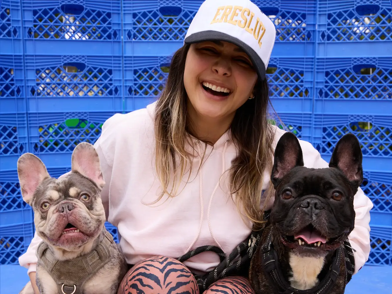 Woman posing with two French Bulldogs